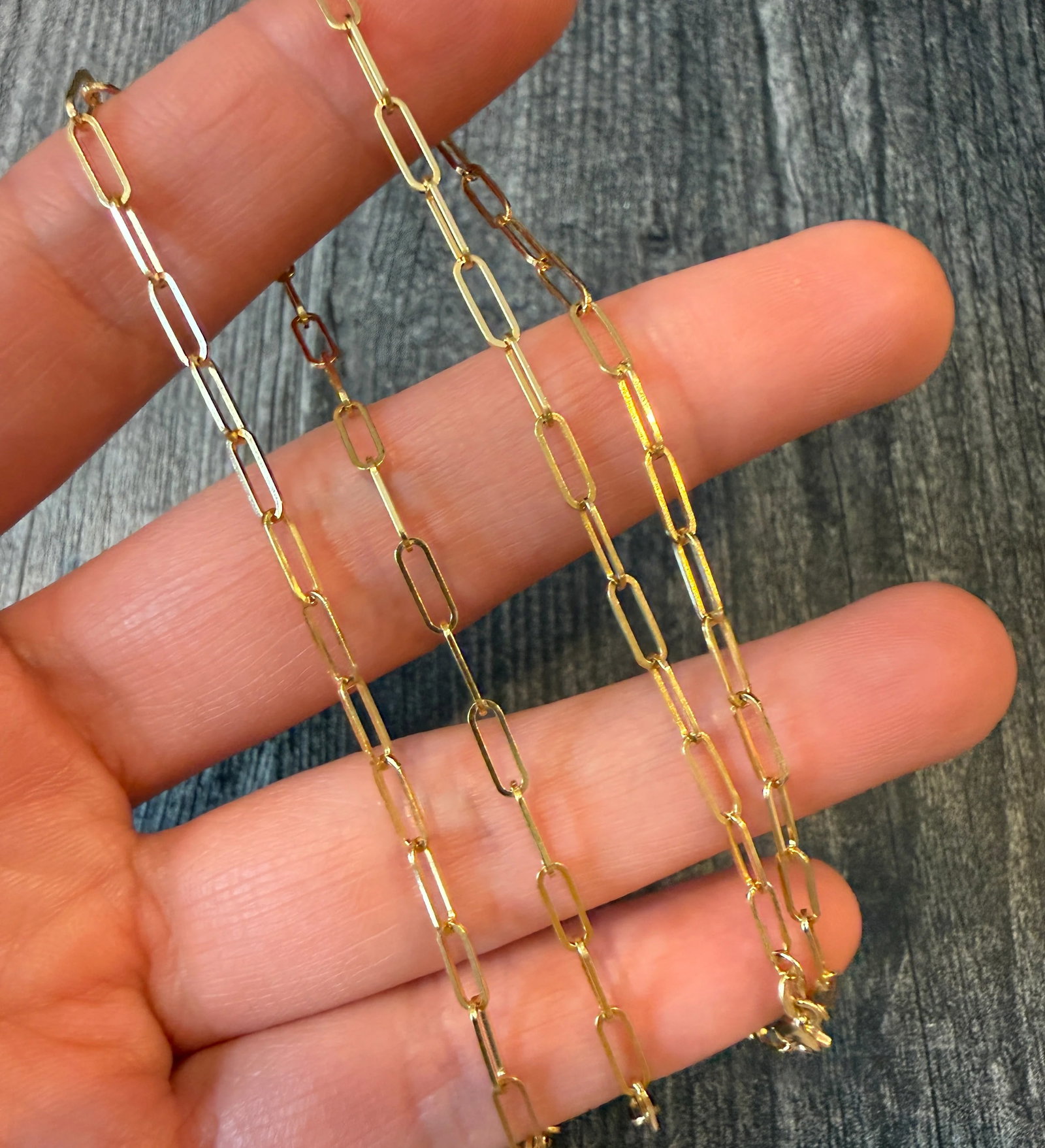 Everyday Paperclip Chain in 14K Gold, 24?? Long: Metal: 14K Yellow Gold Weight: 5.4 gramsMeasurements: 24 inches long by 2.5 mm wideMarkings: "14K"Condition: In very good condition with some minor surface wear Follow us on Instagram @alphaomegajewel