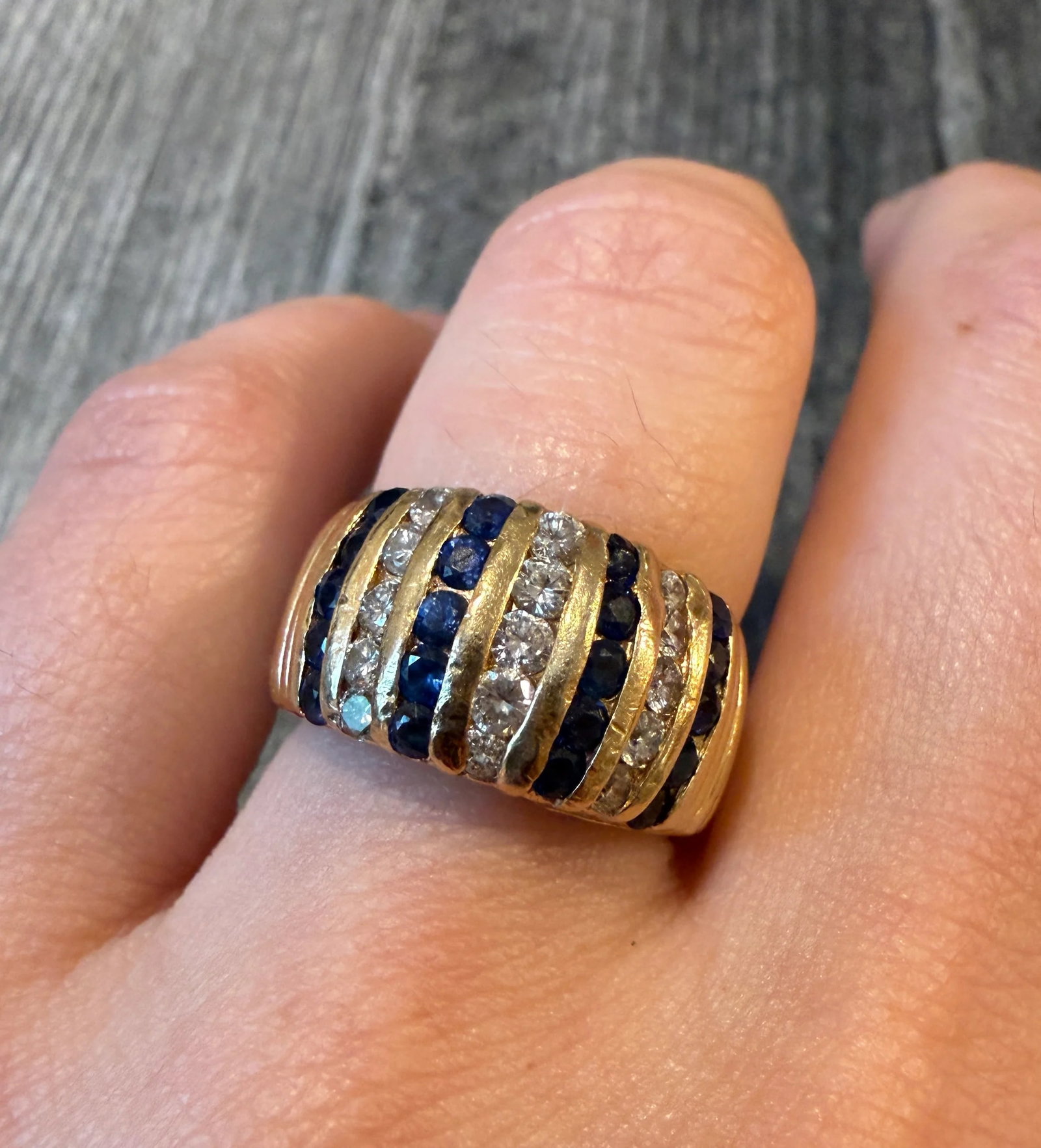 Vertically Set Sapphire and Diamond Band in 14K Gold: Metal: 14K Yellow Gold Weight: 8.5 gramsSapphires: Approximately 1 caratDiamonds: Approximately 0.65 caratsRing Size: 6.25 (slightly resizable)Condition: In good condition with some minor surface wear