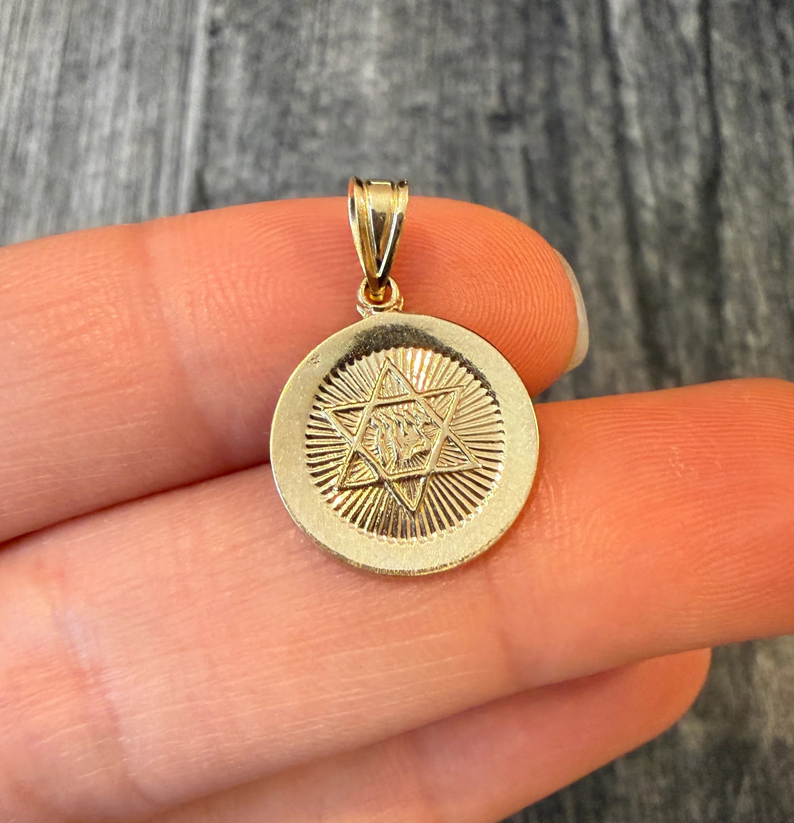 Small Star Of David Disc Charm in 14K Gold: Metal: 14K Yellow Gold Weight: 1.6 gramsMeasurements: 0.6 inch diameterMarkings: "14K"Condition: In good condition with some minor surface wear Follow us on Instagram @alphaomegajewelry for the latest