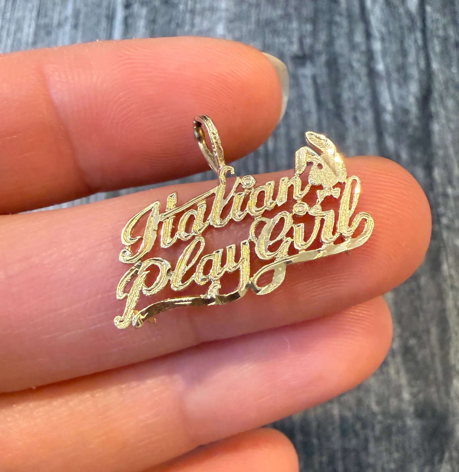 Vintage Italian PlayGirl Charm in 14K Gold: Metal: 14K Yellow Gold Weight: 1.1 gramsMeasurements: 0.5 inches long by 1 inch wideMarkings: "14K"Condition: In good condition with some minor surface wear Follow us on Instagram @alphaomegajewelry f