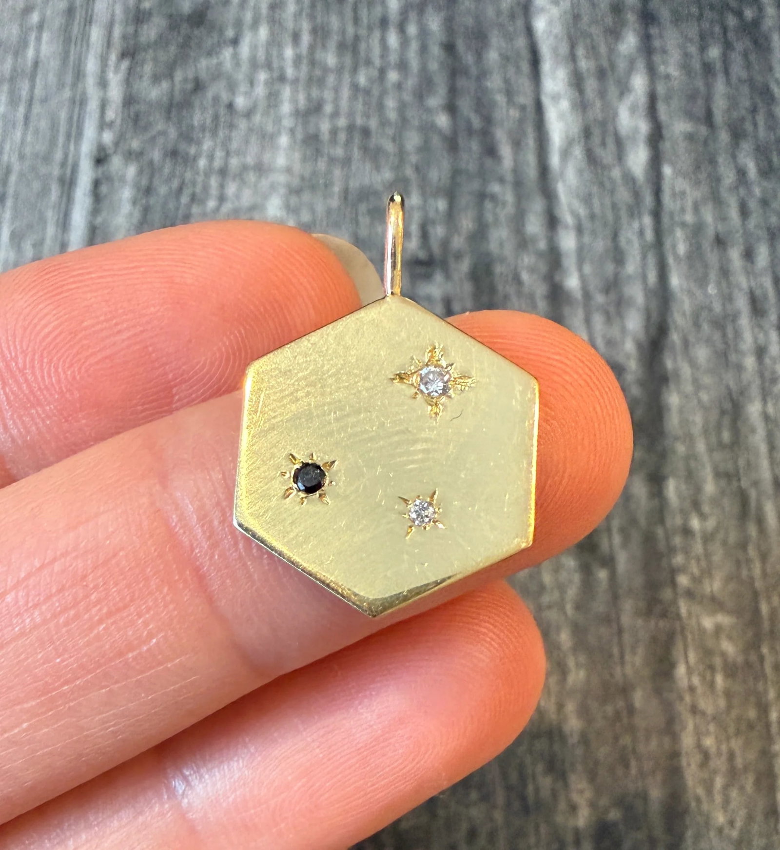 Diamond Hexagon Constellation Charm in 18K Gold: Metal: 18K Yellow Gold (acid tested)Weight: 2.8 grams Measurements: 0.7 inches long by 0.65 inches wideCondition: In very good condition with some minor surface wear Follow us on Instagram @alphaomega