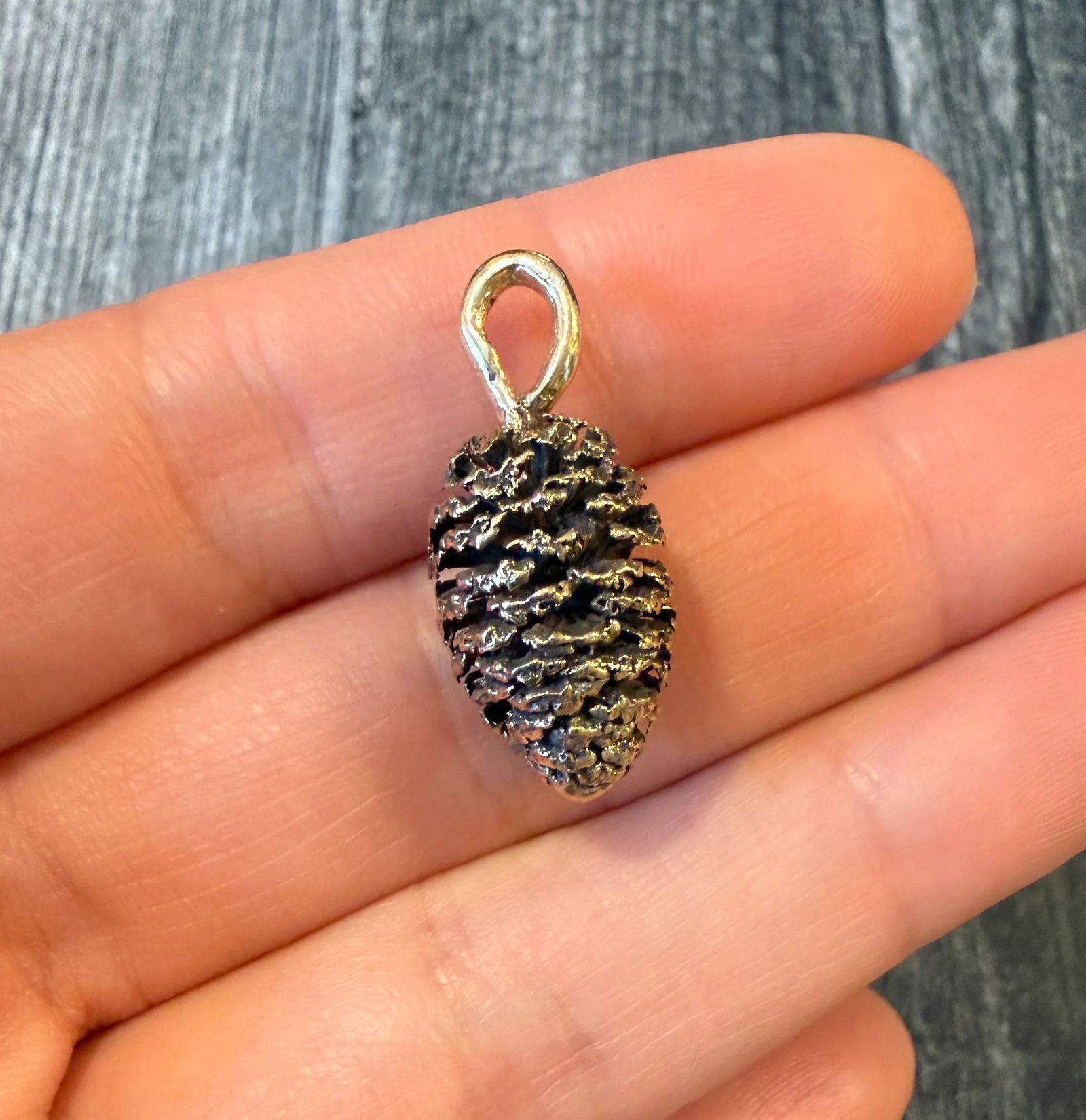 Realistic Pinecone Charm in 14K Gold: Metal: 14K Yellow Gold Weight: 4.5 gramsMeasurements: 0.75 inches long by 0.5 inches wideMarkings: "14K”Condition: In very good condition with some minor surface wear Follow us on Instagram @alp