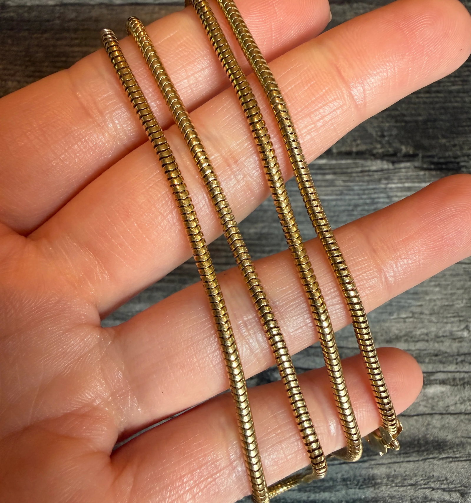 Vintage Tubular Snake Chain in 14K Gold, 24" Long: Metal: 14K Yellow Gold Weight: 19.3 gramsMeasurements: 24 inches long by 2.4 mm wideMarkings: "585 14K"Condition: In very good condition with some minor surface wear Follow us on Instagram @alphaomega
