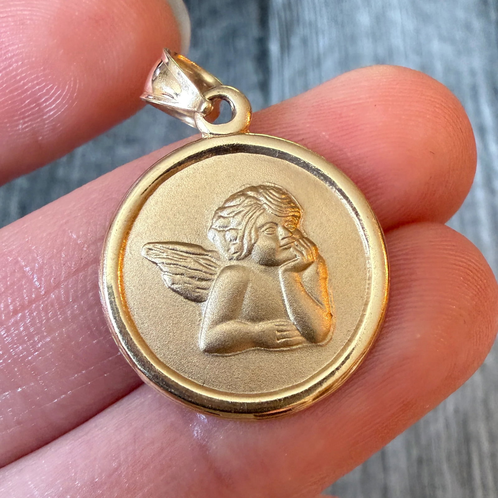 14K Gold Cherub or Angel Charm: Metal: 14K Yellow Gold Weight: 2.2 gramsMeasurements: 0.75 inches wideMarkings: "14K"Condition: In very good condition with some minor surface wear Follow us on Instagram @alphaomegajewelry for the la