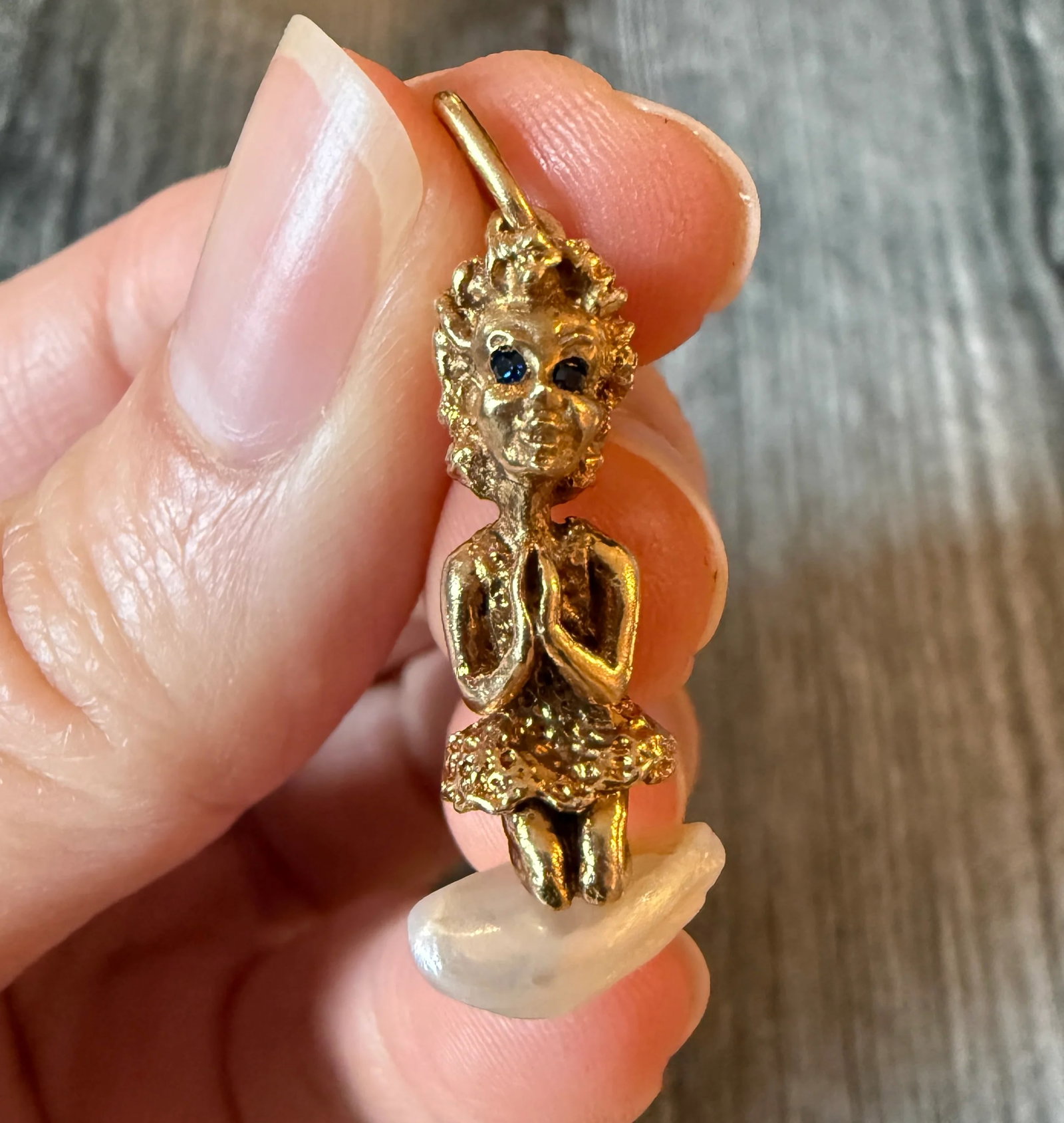 Vintage 14K Gold Praying Child Charm: Metal: 14K GoldWeight: 6.1 gramsMeasurements: 1.2 inches long by 0.5 inches wideMarkings: NoneCondition: In good condition with minor surface wear.Follow us on Instagram @alphaomegajewelry for the lat