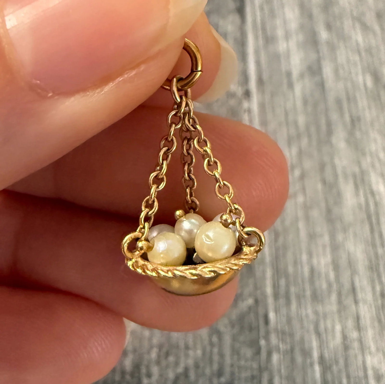 Vintage 14K Gold Basket of Pearl Eggs Charm: Metal: 14K Yellow Gold Weight: 2.5 gramsMeasurements: 0.75 inches long with the chain by 0.5 inches wideCondition: In very good vintage condition with minor surface we are consistent with ageFollow us