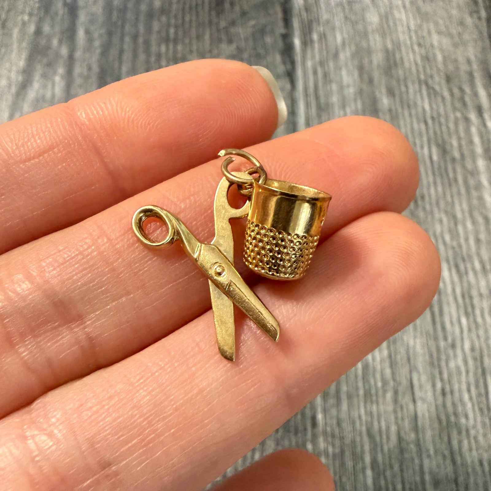 Vintage 14K Gold Thimble and Scissors Sewing Set Charm: Metal: 14K Yellow Gold Weight: 2 gramsMeasurements: 0.75 inches longMarkings: "14K"Condition: In very good vintage condition with some minor surface square consistent with ageFollow us on Instagram