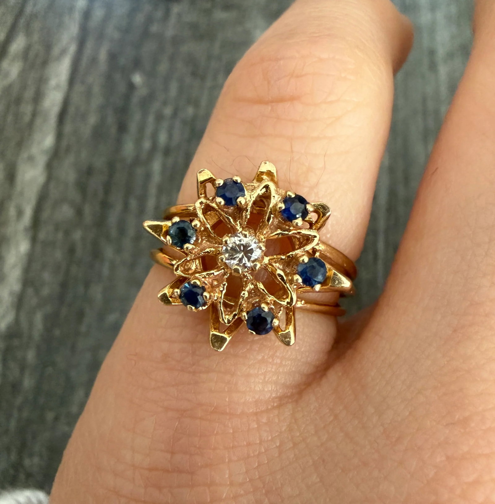 Vintage Sapphire and Diamond Snowflake Ring in 14K Gold: Metal: 14K Yellow Gold Weight: 3.4 gramsSapphires: Approximately 0.24 caratsDiamonds: Approximately 0.06 caratsRing Size: 4.5 (resizable)Markings: "14K TRUBRITE K"Condition: In good vintage condition