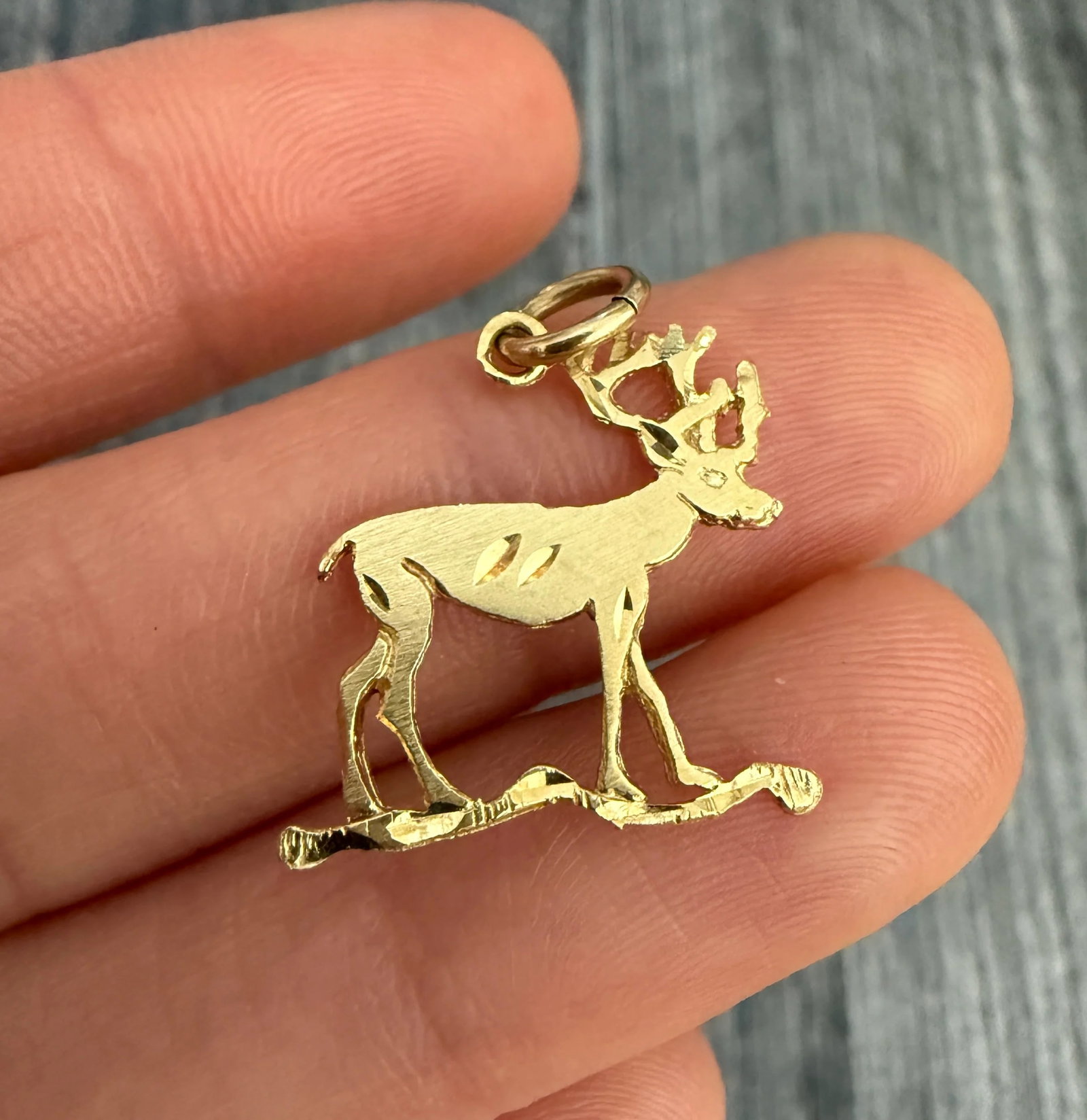 14K Gold Stag or Buck Charm: Metal: 14K Yellow Gold Weight: 1.4 gramsMeasurements: 0.75 inches long by 0.75 inches wideMarkings: "14K"Condition: In good vintage condition with some minor surface wear consistent with ageFollow us