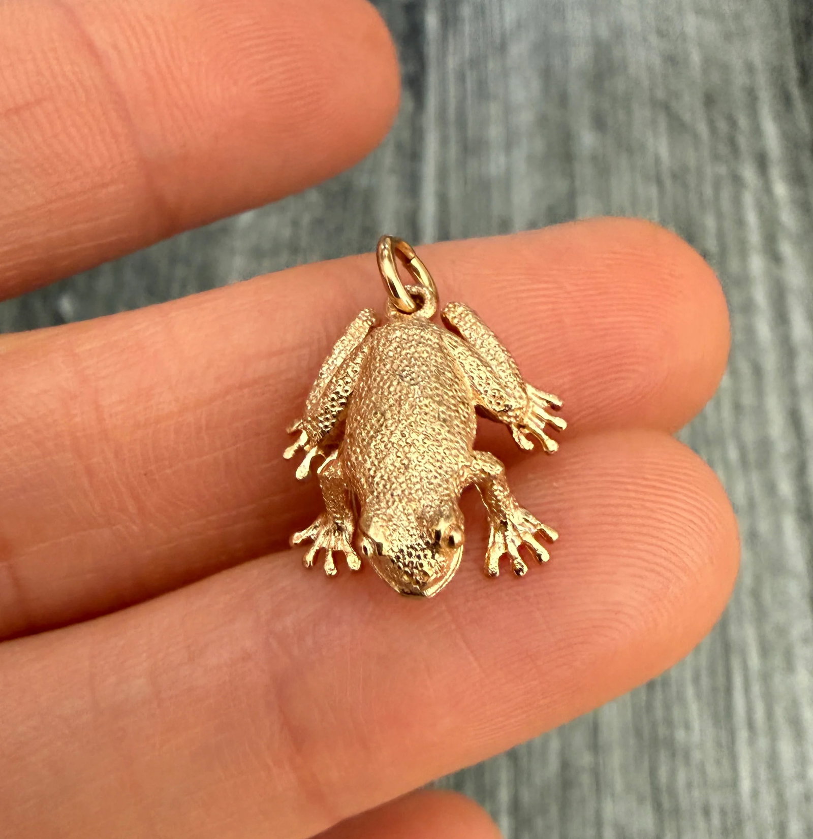 English 14K Gold Frog Charm: Metal: 14K Yellow Gold Weight: 4.2 gramsMeasurements: 0.75 inches long by 0.55 inches wideMarkings: "14 585" with English assay marksCondition: In good vintage condition with some minor surface wear