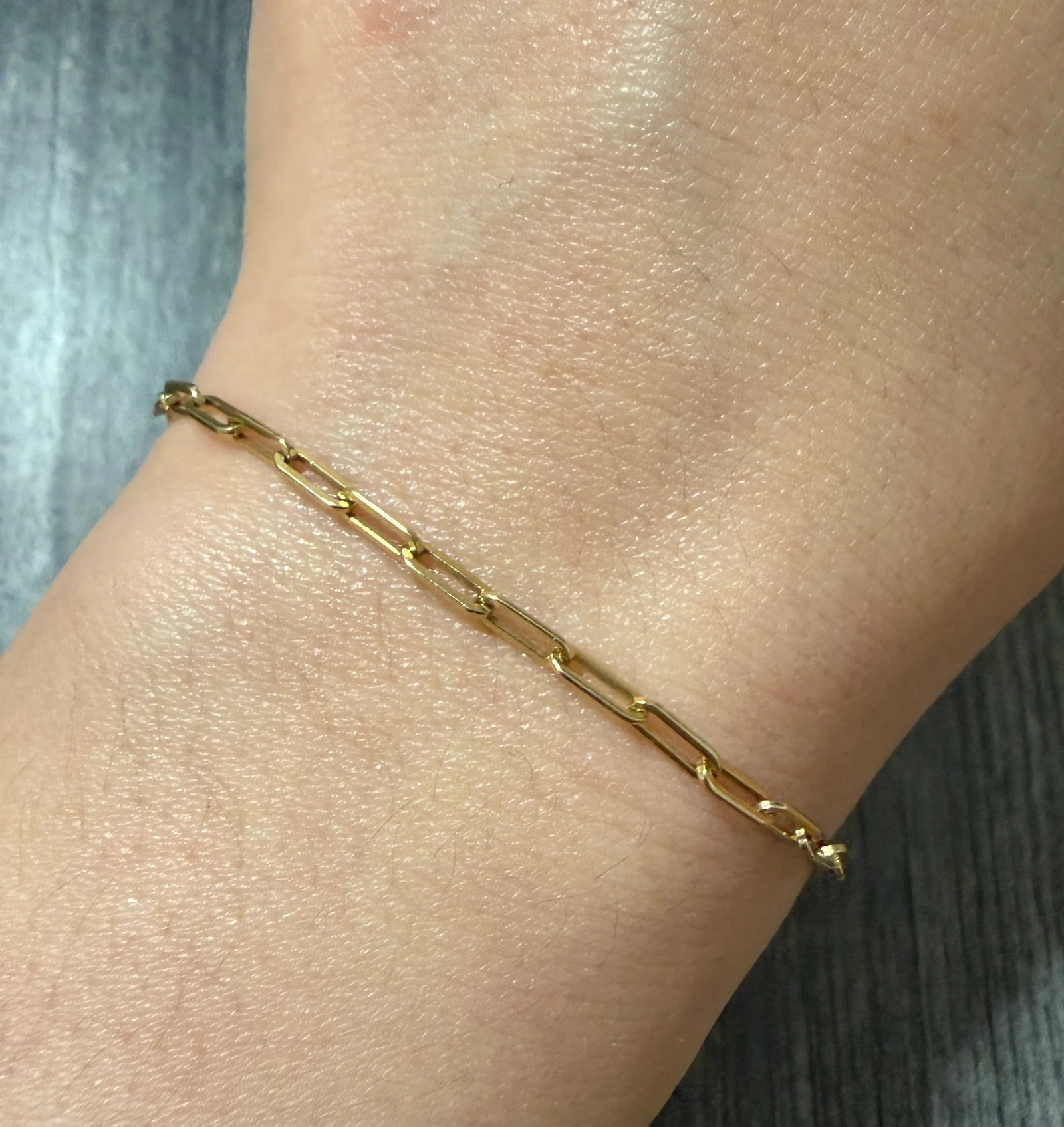 Simple 14K Gold Paperclip Bracelet, 7.2" Long: Metal: 14K Yellow Gold Weight: 2.7 gramsMeasurements: 7.2 inches long by 2.4 mm wideMarkings: "14K"Condition: In good condition with some minor surface wearFollow us on Instagram @alphaomegajewelry fo