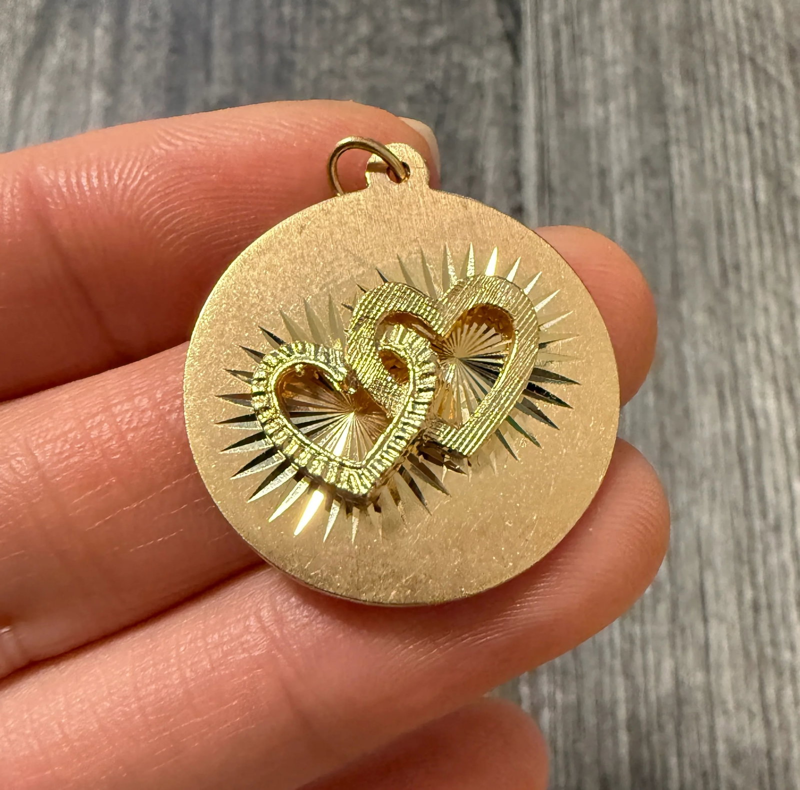 Vintage 14K Gold Charm of Interlocked Hearts: Metal: 14K Yellow Gold Weight: 5.2 gramsMeasurements: 1 inch diameter Markings: "CREA 14K"Condition: In good condition with some minor surface wearFollow us on Instagram @alphaomegajewelry for the lat