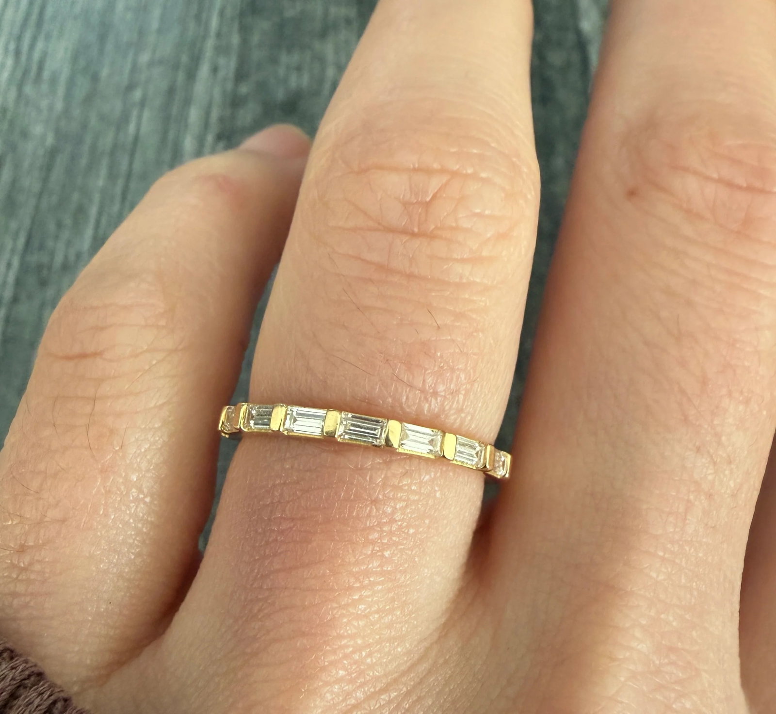 VRAI Lab Grown Baguette Diamond Band in 18K Gold: Metal: 18K Yellow Gold Weight: 2.4 gramsLab Grown Diamonds: Approx 0.45 ctsRing Size: 6.75 Width: 2 mm wide Markings: "VRAI 750"Currently retails for $1000Condition: In very good condition with some m
