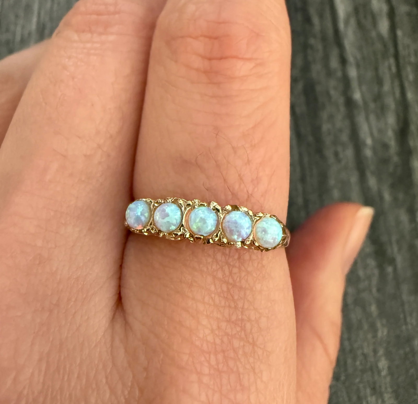 Vintage English 5 Stone Opal Band in 9K Gold: Metal: 9K Yellow GoldWeight: 1.9 gramsRing Size: 8.25 (resizable)Width: 4.3 mm wideMarkings: "375" and English HallmarksCondition: In good vintage condition with some minor surface wear.Follow us on I