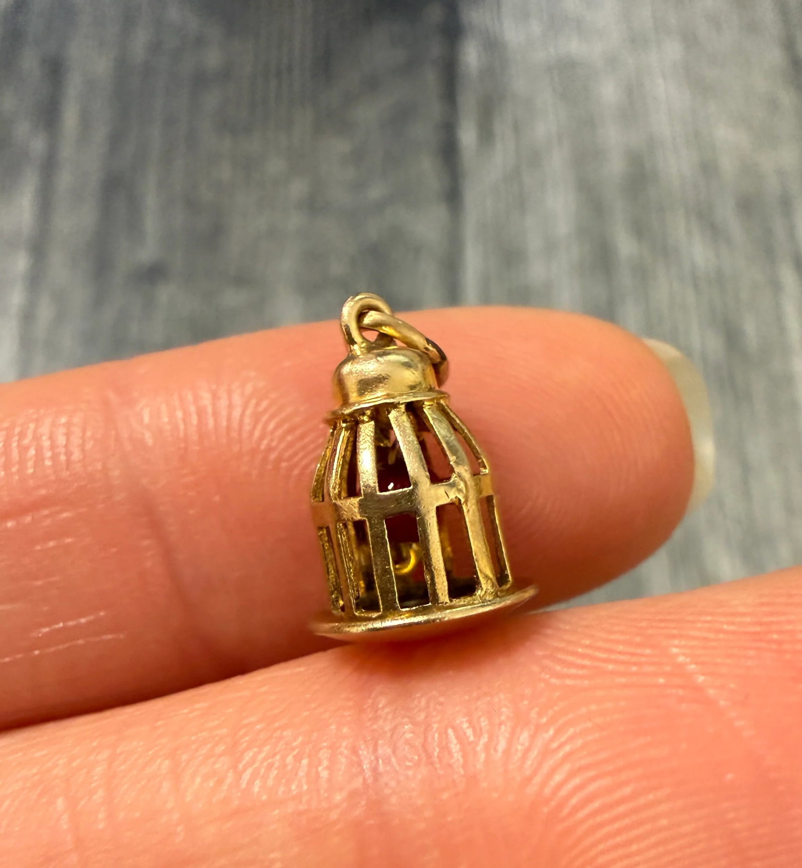 Vintage Bird Cage Charm In 14K Gold: Metal: 14K Yellow Gold Weight: 1.1 gramsMeasurements: 0.4 inches long by 0.3 inches longMarkings: "14K"Condition: In very good condition with some minor surface wear consistent with age.Follow us on I