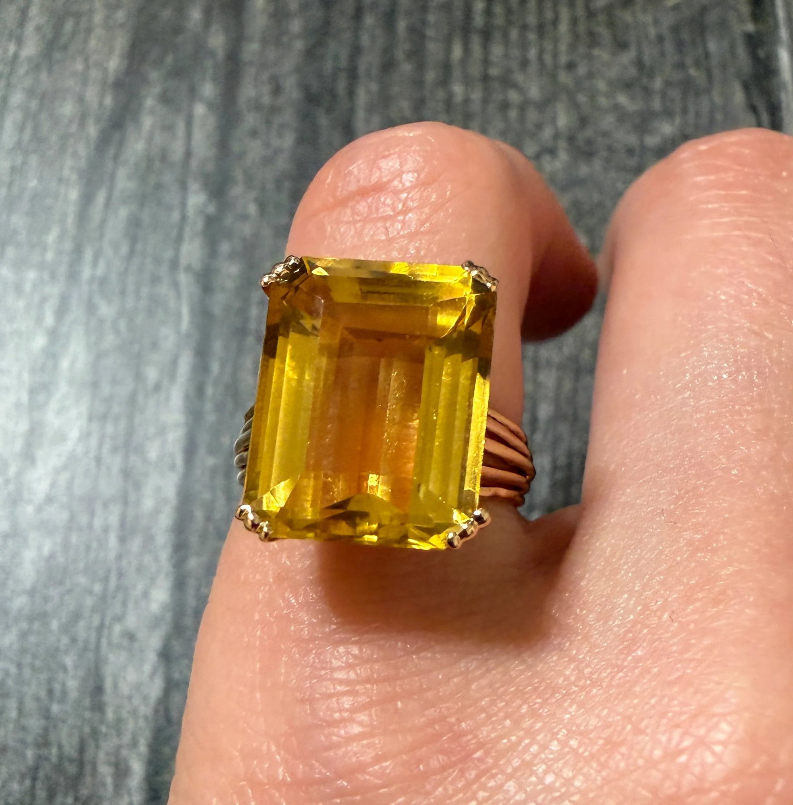 Midcentury Emerald Cut Citrine and 18K Gold Cocktail Ring (S): Metal: 18K Rosy GoldWeight: 5.4 gramsRing size: 5.25 (resizable but the pattern on the shank will be interrupted)Markings: "18K"Condition: In good vintage condition with some minor surface wear consis