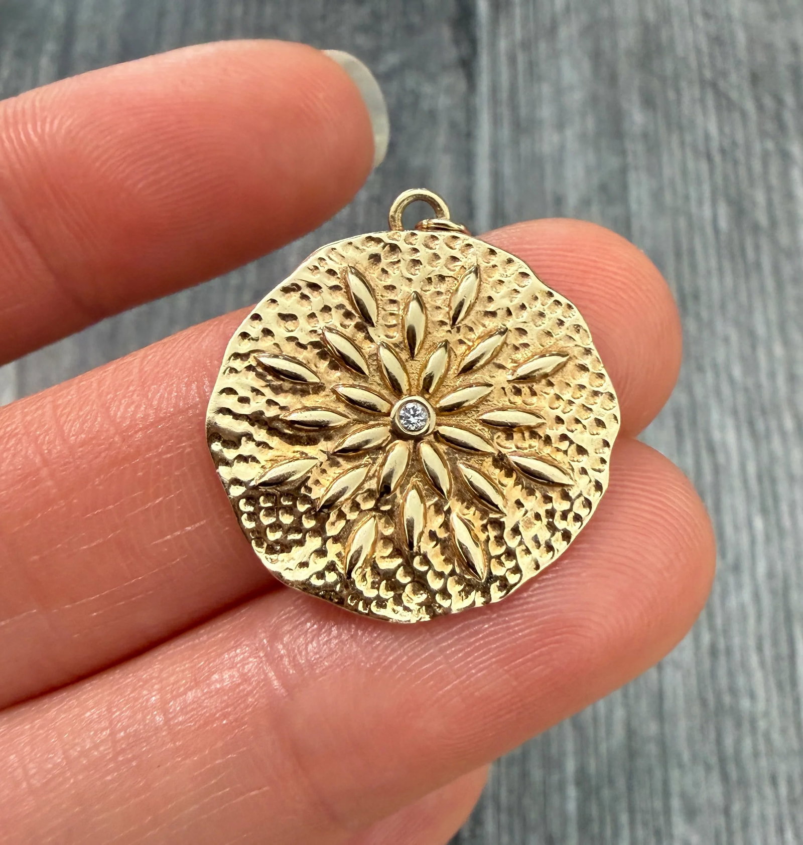 Abstract Fireworks or Flower Diamond Pendant in 14K Gold: Metal: 14K Yellow Gold Weight: 3.1 gramsDiamonds: Approximately 0.01 caratsMeasurements: 0.8 inches diameter Markings: "14"Condition: The current bale is quite small and won't fit through most chains 