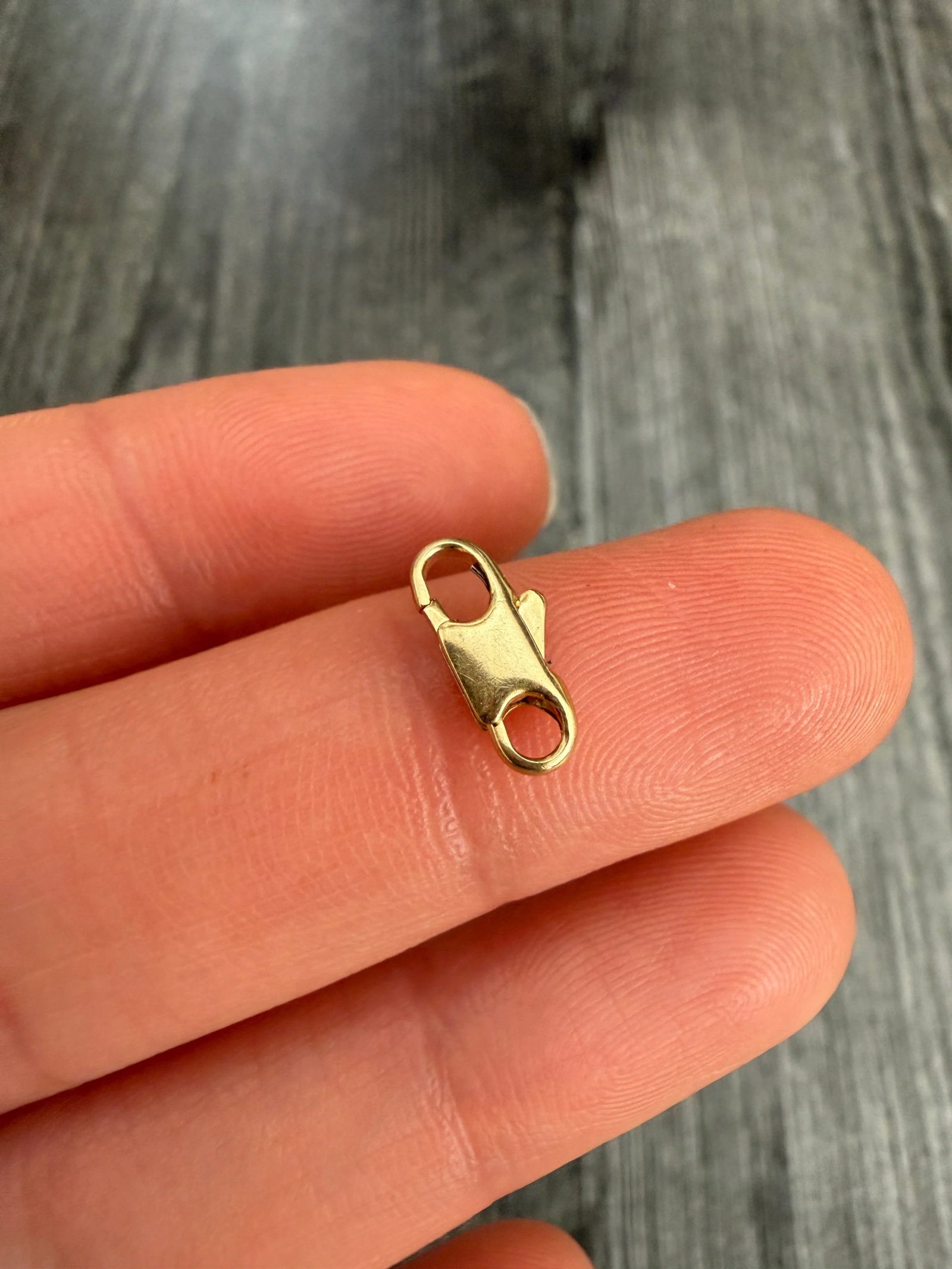Small 14K Gold Lobster Clasp: Metal: 14K Yellow Gold Weight: 0.6 gramsMesuarment: 0.45 inches long by 0.2 inches wideMarkings: "585"Condition: In good condition with some minor surface wear Follow us on Instagram @alphaomegajewelr