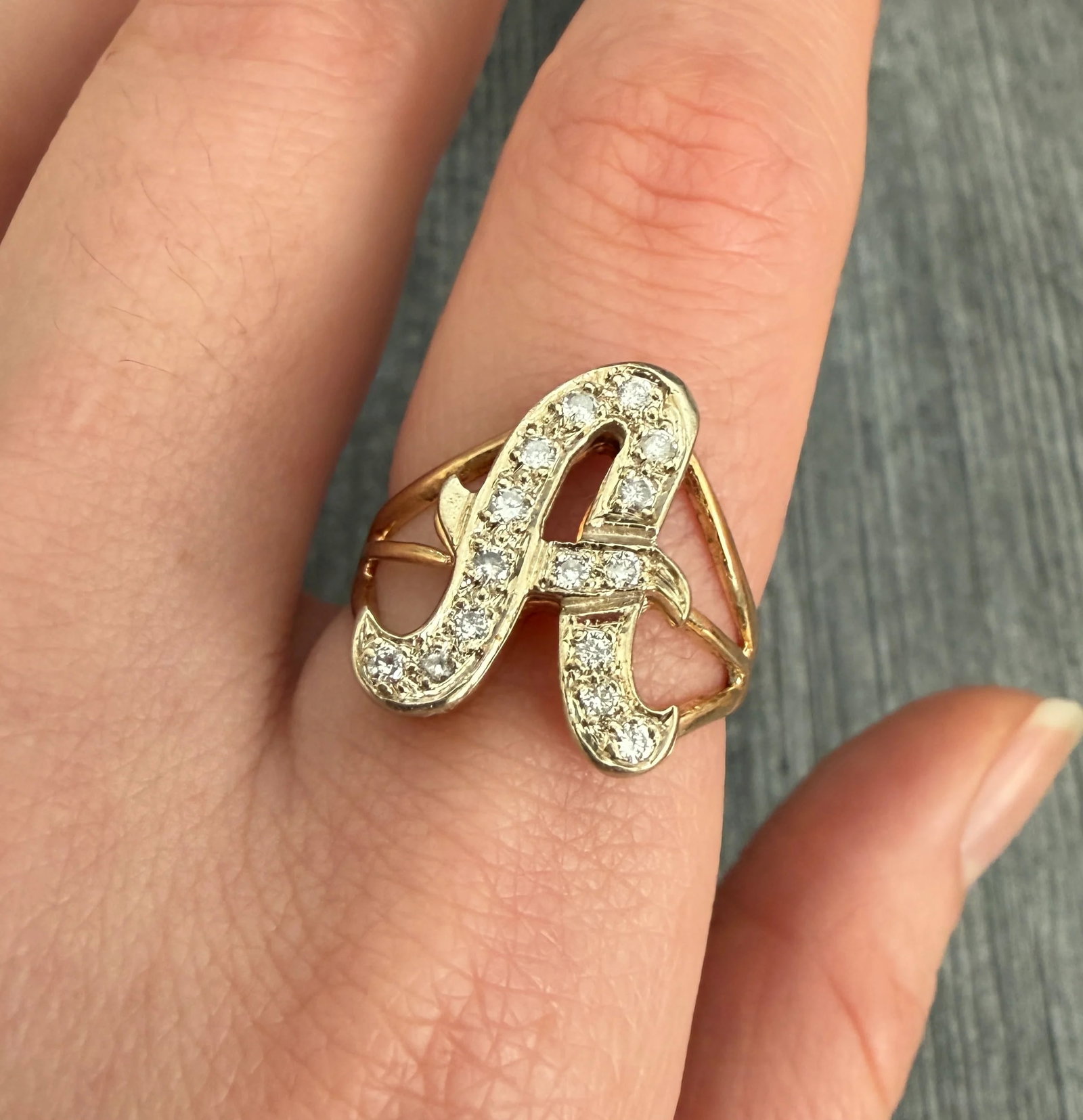 Diamond Initial A Ring in 14K Gold: Metal: 14K Yellow & White GoldWeight: 4.9 gramsDiamonds: Approximately 0.20 caratsRing Size: 8 (resizable)Condition: The ring appears to have been previously resized. Otherwise, in good vintage condit