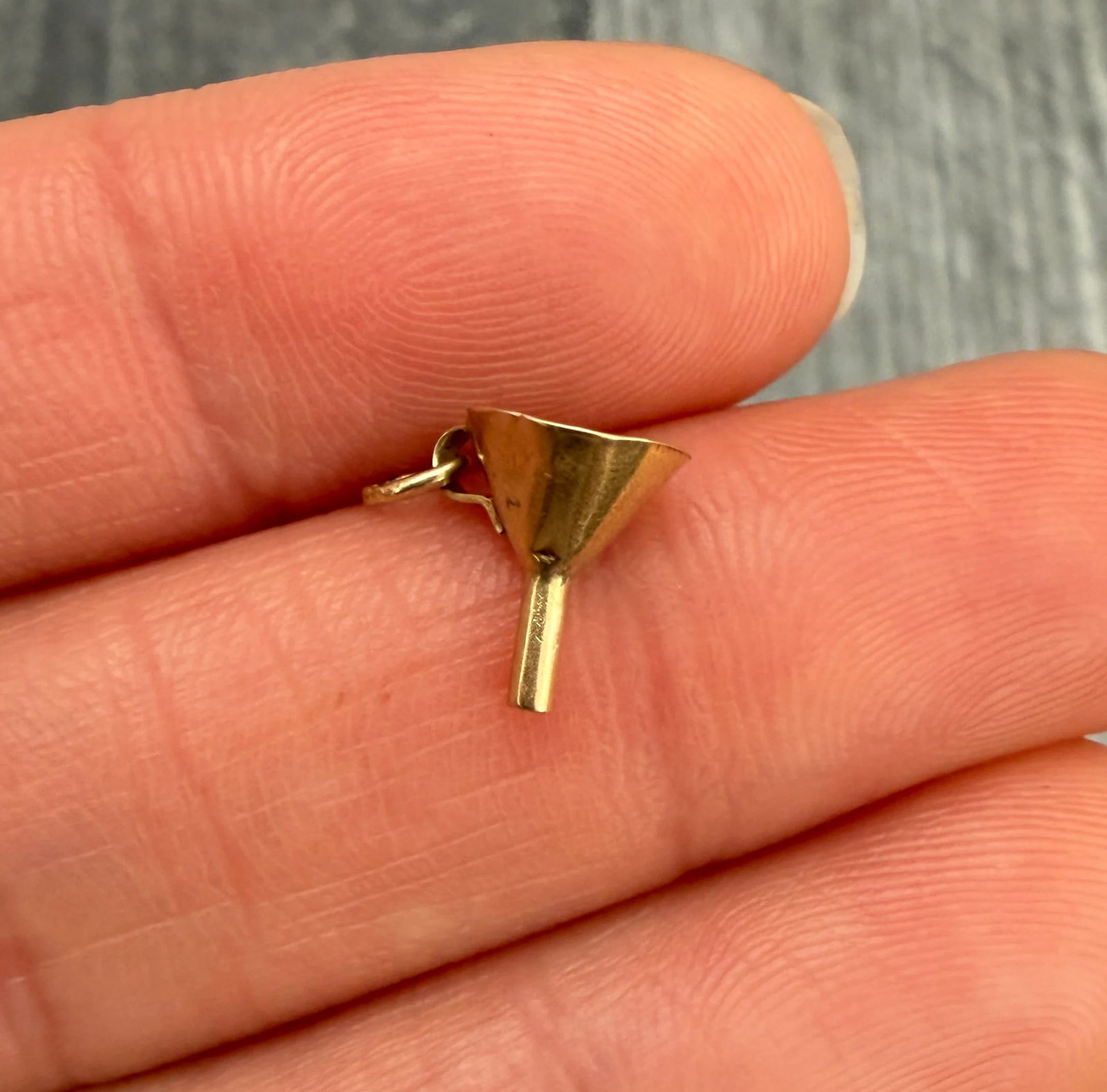 Vintage 14K Gold Funnel Charm: Metal: 14K Yellow Gold (Acid Tested)Weight: 0.3 gramsMeasurements: 0.35 inches long by 0.3 inches wideMarkings: NoneCondition: Some small dings throughout the charm and some surface wearFollow us on I