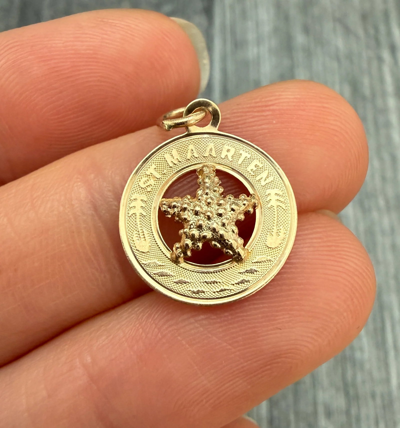St. Maarten Starfish 14K Gold Charm: Metal: 14K Yellow GoldWeight: 0.9 gramsMeasurements: 0.55 inches diameterMarkings: "CREA 14K"Condition: In very good condition with some minor surface wear consistent with age.Follow us on Instagram @