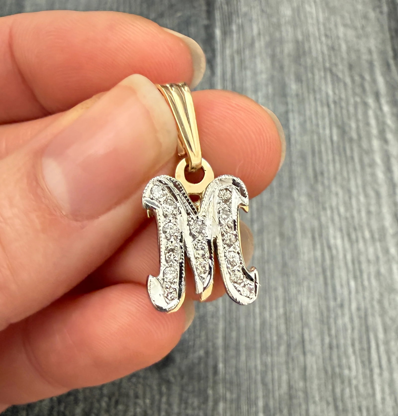Diamond and 14K Gold Initial M Charm: Metal: 14K Yellow Gold (acid tested)Weight: 4.3 gramsDiamonds: Approximately 0.30 caratsMeasurements: 0.6 inches long by 0.5 inches wide Markings: NoneCondition: In very good vintage condition with so