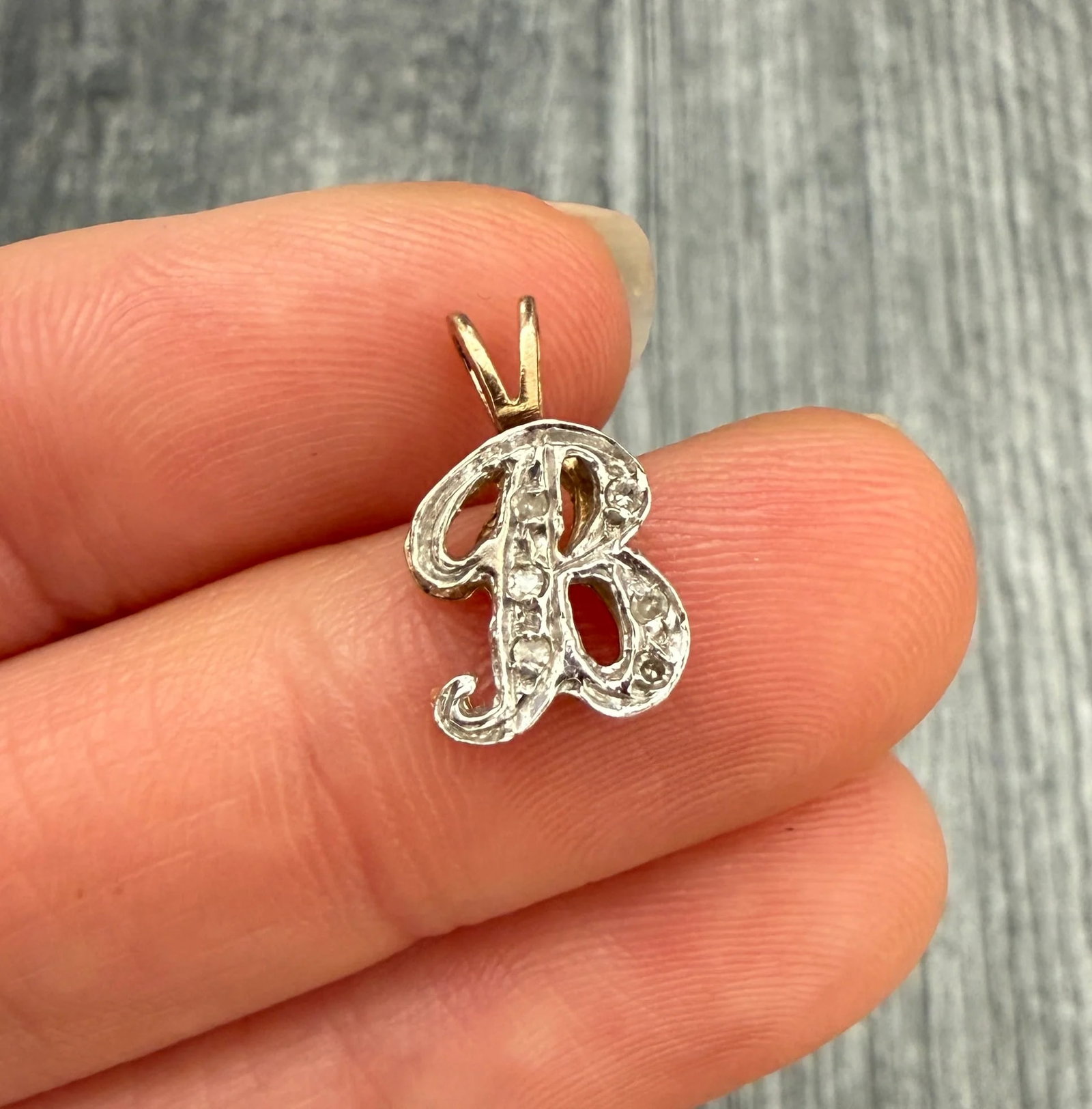 Smaller Diamond and 14K Gold Initial B Charm: Metal: 14K GoldWeight: 1.2 gramsMeasurement: 0.45 inches long by 0.35 inches wideCondition: In good condition with some minor surface wear Follow us on Instagram @alphaomegajewelry for the latest upda