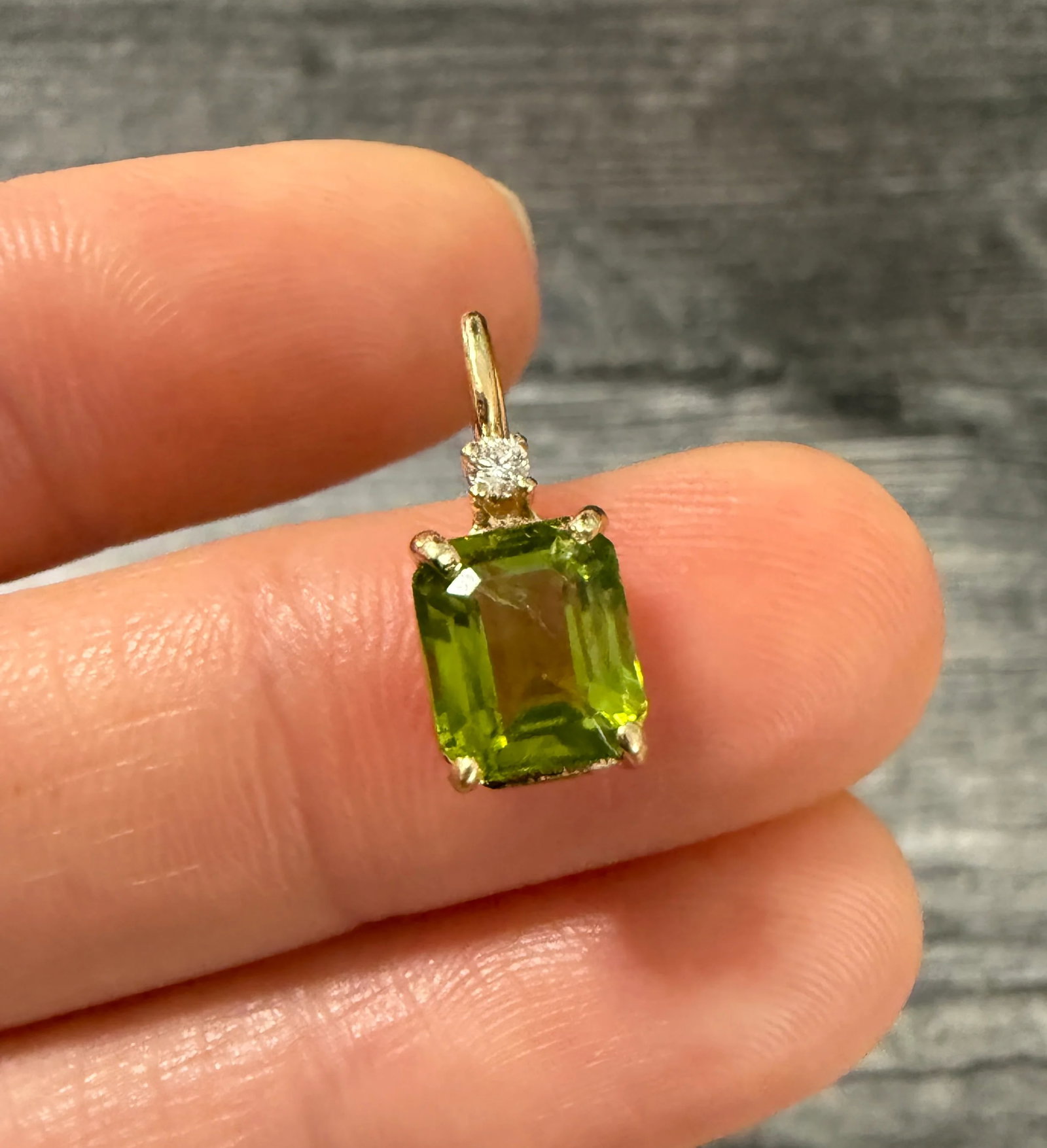 Peridot and Diamond Charm in 14K Gold: Metal: 14K Yellow Gold Weight: 1.2 gramsMeasurements: 8.7 mm long by 6.6 mm wideMarkings: NoneCondition: In very good condition with some minor surface wear. Follow us on Instagram @alphaomegajewelry 