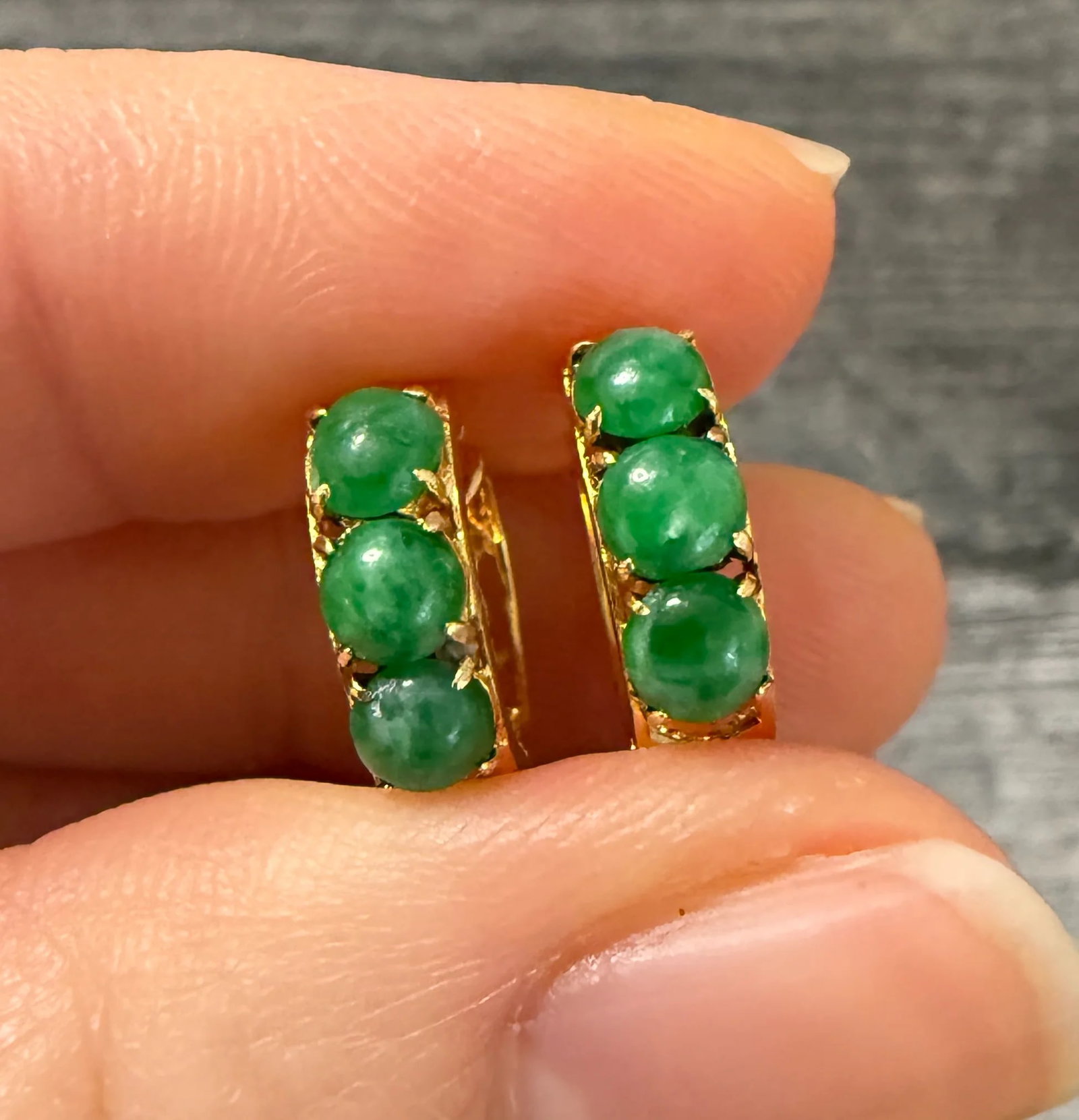 Jade and 14K Gold Huggie Earrings: Metal: 14K Yellow Gold Weight: 3 gramsMeasurements: 0.55 inches longMarkings: "585"Condition: In very good condition with some minor surface wear.Follow us on Instagram @alphaomegajewelry for the late