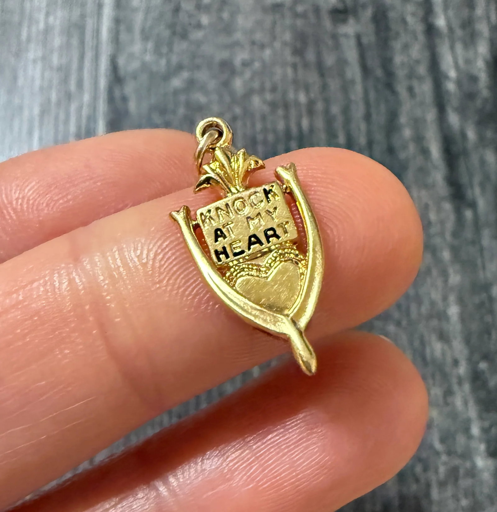 Vintage Enamel "KNOCK AT MY HEART" Door Knocker Charm: Metal: 14K Yellow Gold Weight: 1.9 gramsMeasurements: 0.75 inches long by 0.35 inches wideMarkings: "14K"Condition: In fair condition with enamel loss and some surface wear consistent with age. Follow