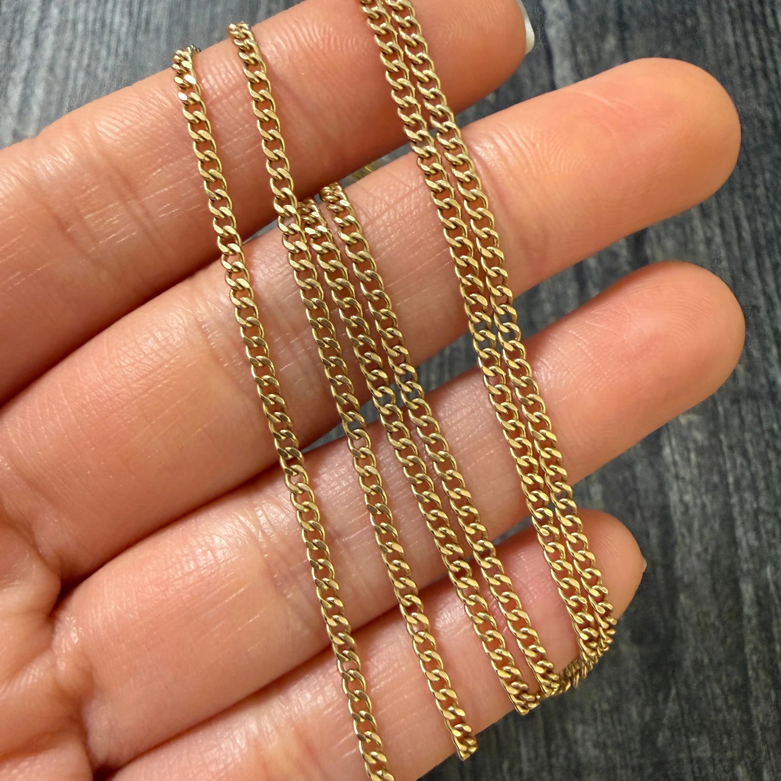 Vintage 14K Gold Curb Link Chain, 24.25" Long: Metal: 14K Yellow Gold Weight: 7.7 gramsMeasurements: 24.25 inches long by 2.1 mm wide Markings: "14K ITALY”Condition: In very good condition with some minor surface wear consistent with age. Pl