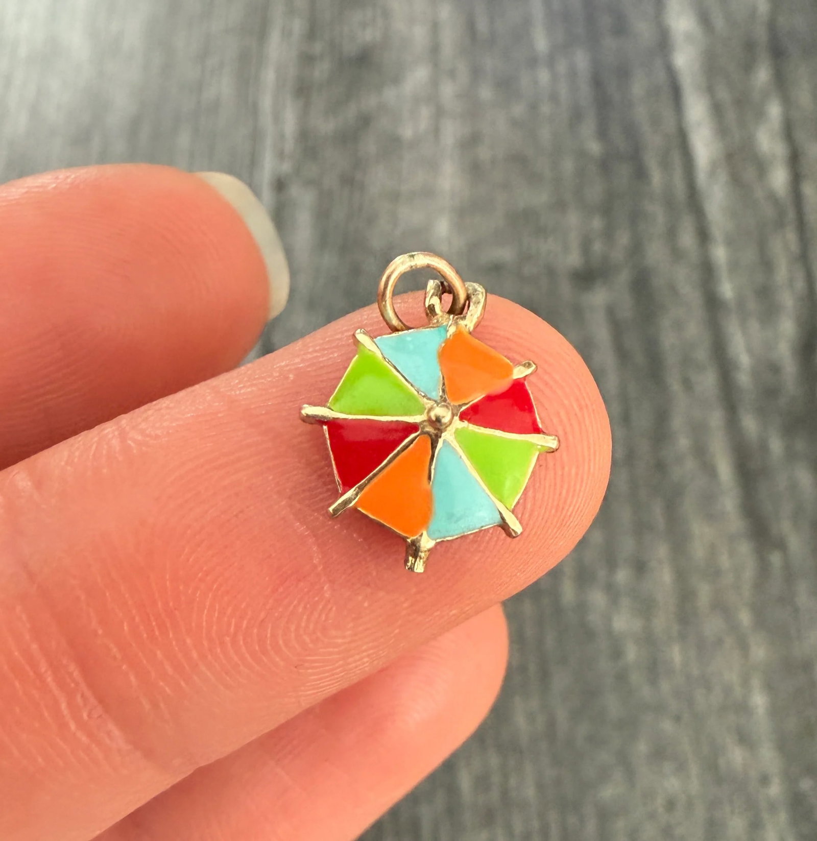 Enamel and 14K Gold Beach Umbrella Charm: Metal: 14K Yellow Gold Weight: 1 gramMeasurements: 0.45 inches diameterMarkings: NoneCondition: In very good condition with some minor surface wear consistent with age. Follow us on Instagram @alphaom