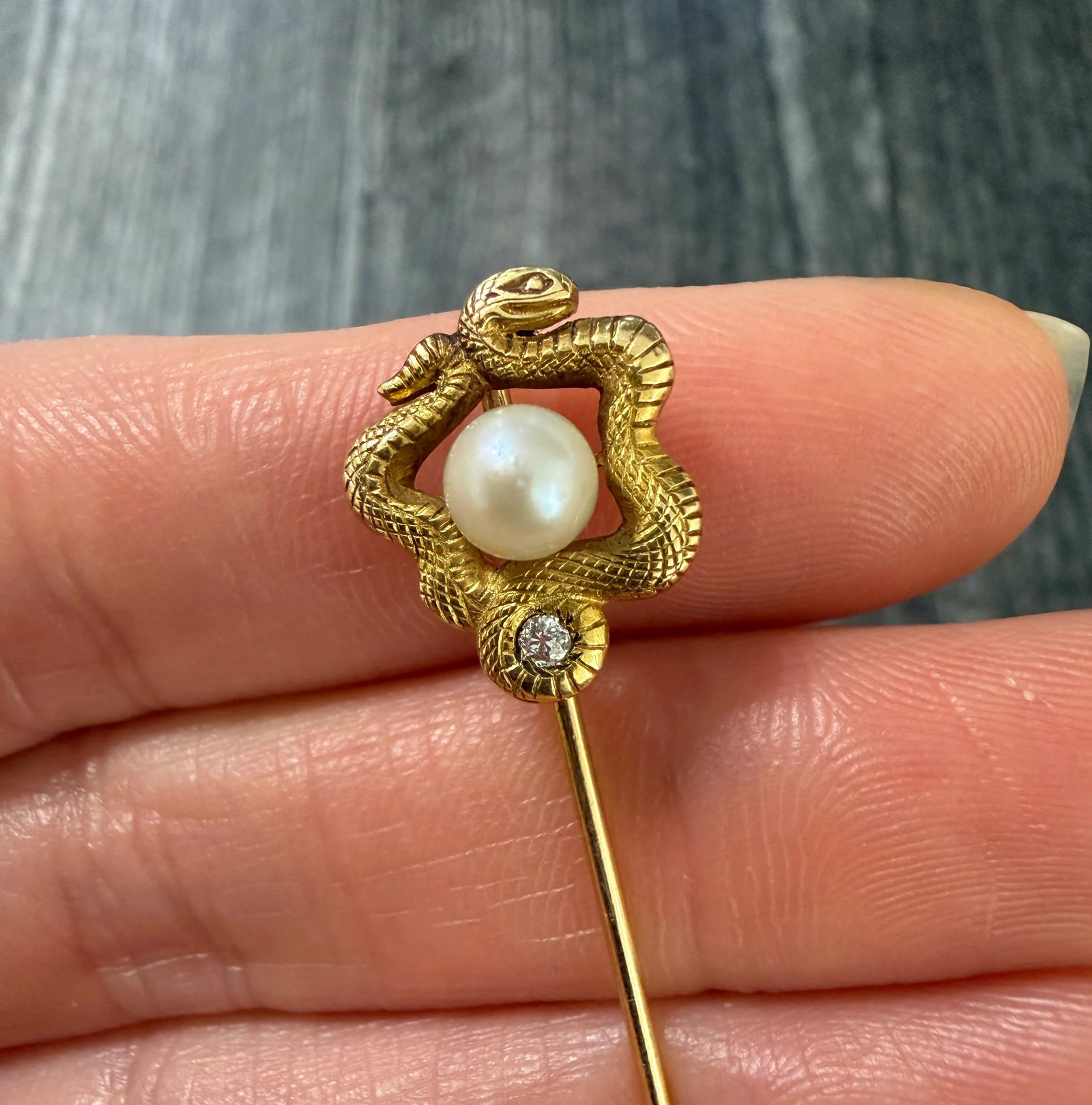 Art Nouveau Diamond and Pearl Snake Stick Pin: Metal: 14K Yellow Gold Weight: 2.4 gramsMeasurements: 2.5 inches long by 0.5 inches wideMarkings: "14"Condition: In very good condition with some minor surface wear consistent with age. Follow us on I
