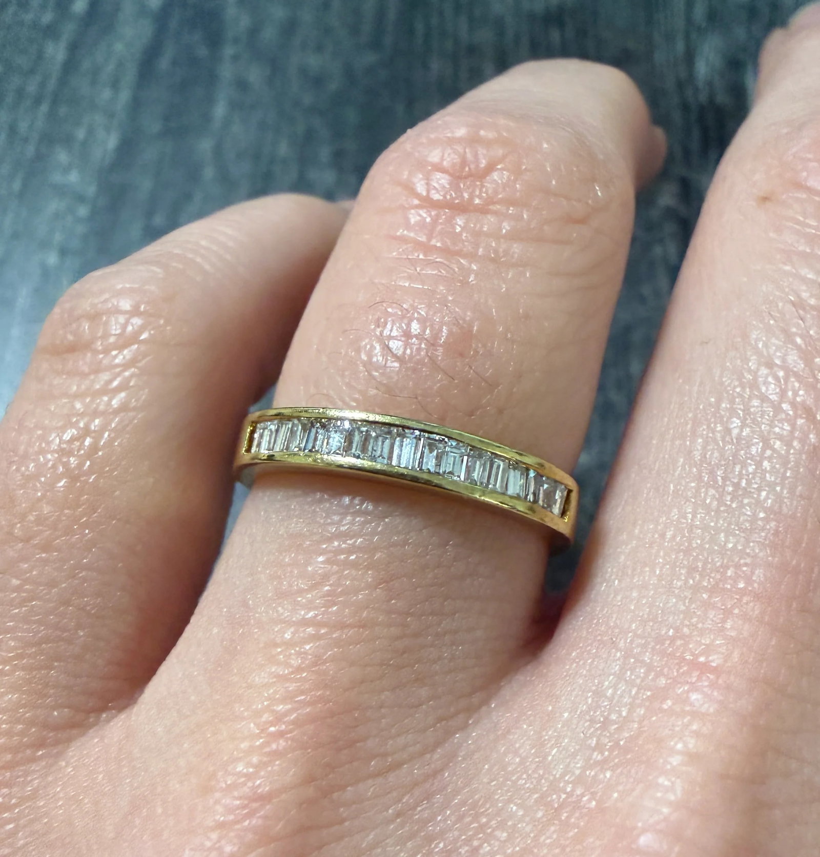 Channel Set Diamond Baguette and 14K Gold Band: Metal: 14K Yellow Gold Weight: 2.8 gramsDiamonds: Approximately 0.45 caratsWidth: 2.9 mm wideRing size: 5.5Markings: "S14K" Condition: In very good condition with some minor surface wear. Follow us on