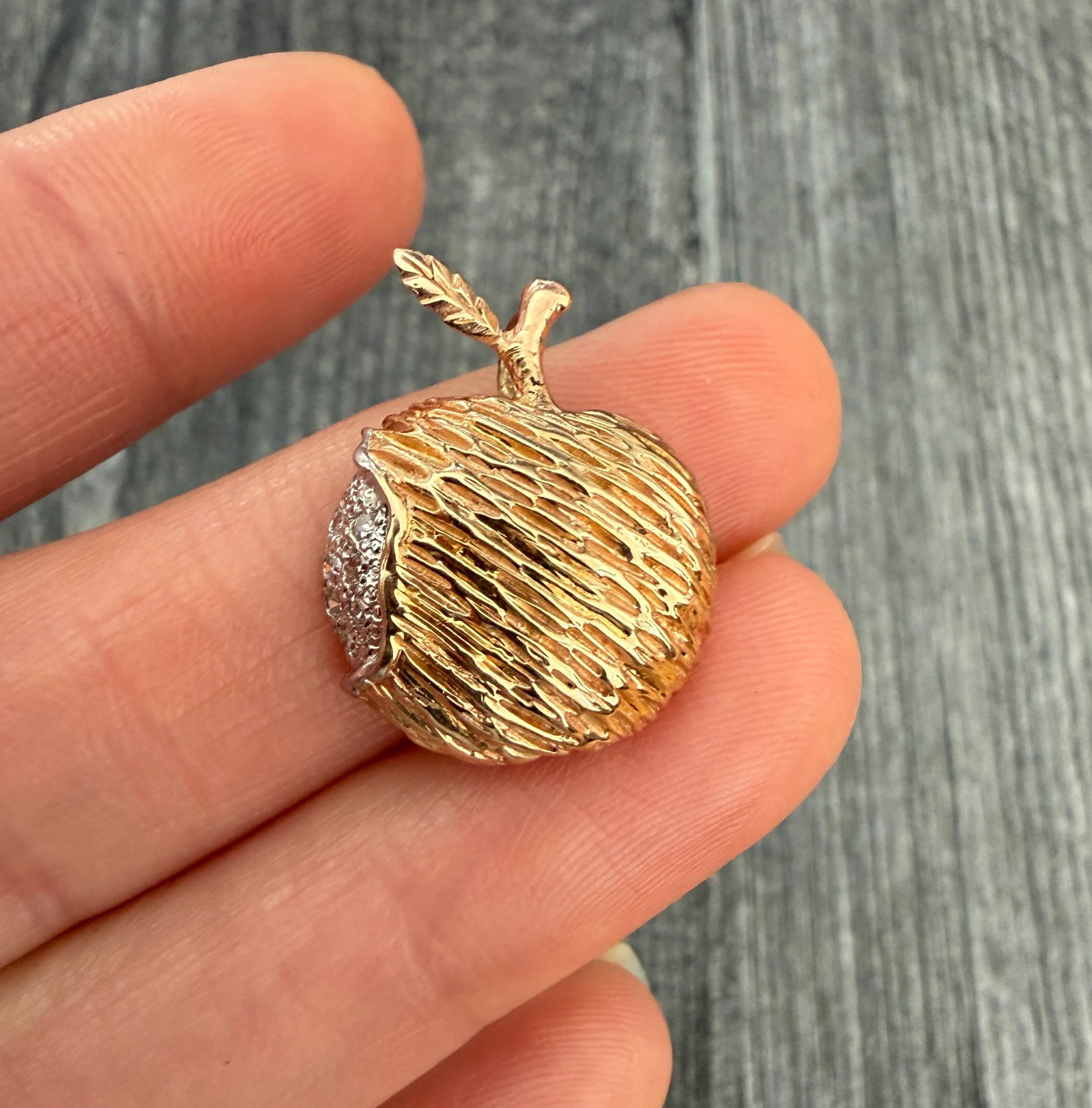 Vintage Diamond and 14K Gold Textured Apple Charm: Metal: 14K Gold Weight: 3 gramsDiamonds: Approximately 0.035 caratsMeasurements: 0.85 inches long by 0.7 inches wide Markings: "14K- LDCondition: In very good condition with some minor surface wear. F