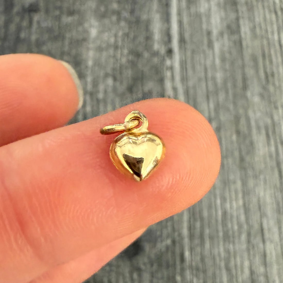 Mini 18K Gold Puffy Heart Charm: Metal: 18K Yellow Gold Weight: 0.4 gramsMeasurements: 0.25 inches long by 0.25 inches wideMarkings: NoneCondition: In very good condition with some minor surface wear consistent with age. Follow us on