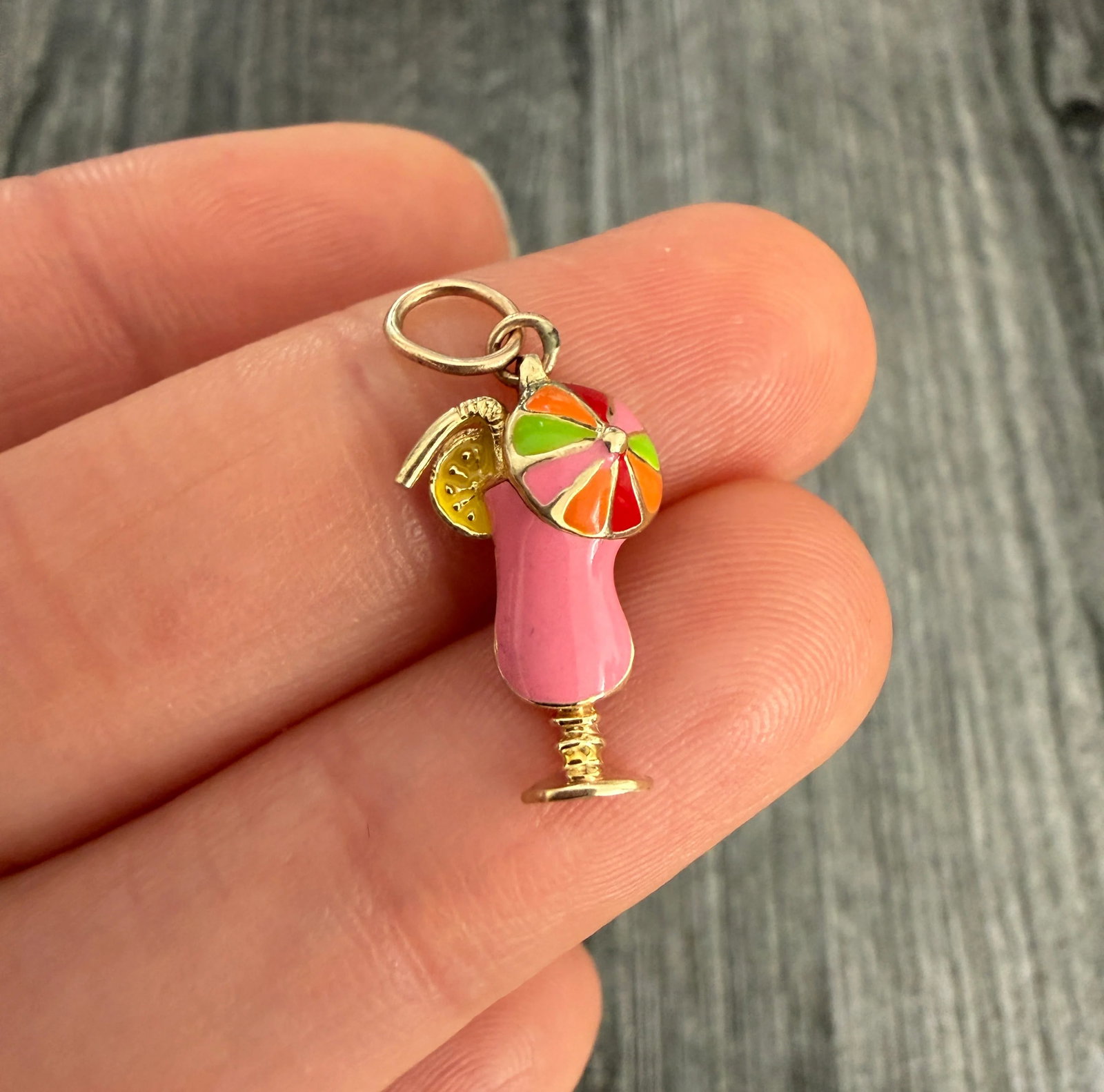 Bright Enamel and 14K Gold Tropical Cocktail Charm: Metal: 14K Yellow Gold (Acid Tested)Weight: 1.4 gramsMeasurements: 0.7 inches long by 0.45 inches wideMarkings: NoneCondition: In very good condition with some minor surface wear consistent with age. 