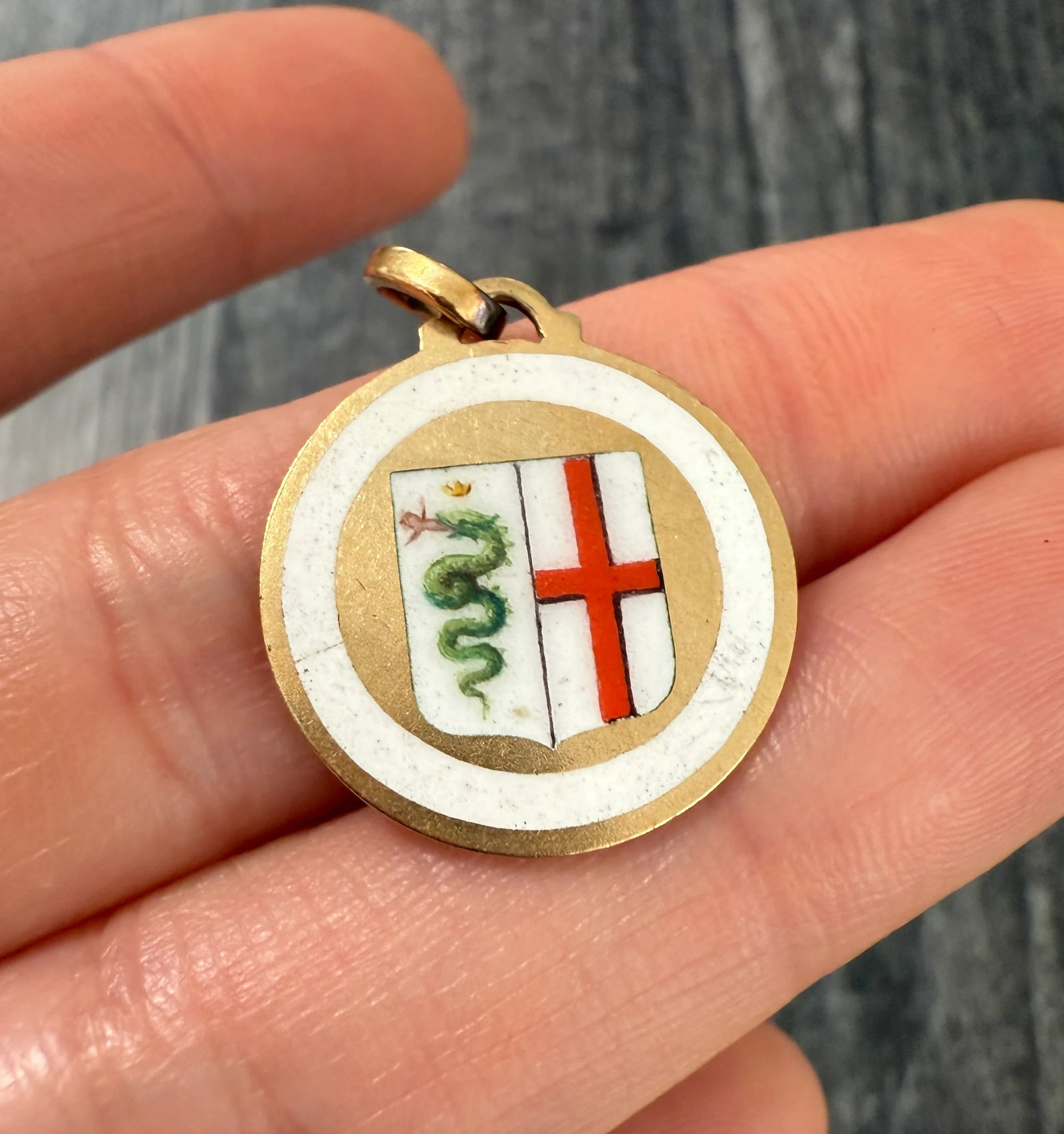 Enameled 18K Gold Shield of Milan Italy: Metal: 18K Yellow Gold (bale is not gold)Weight: 3.8 gramsMeasurements: 0.8 inches diameterMarkings: "750"Condition: In very good condition with some minor surface wear consistent with age. Follow us 