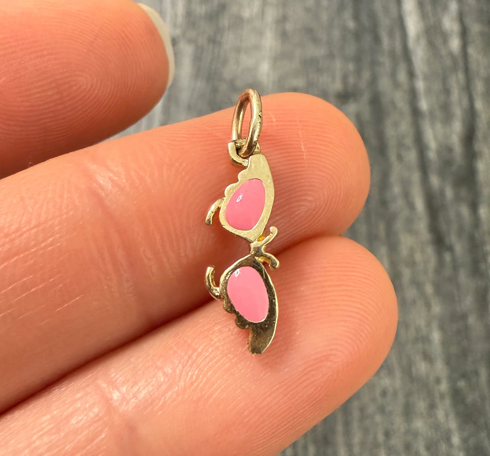 Pink Enamel and 14K Gold Sunglass Charm: Metal: 14K Yellow Gold (Acid Tested)Weight: 0.7 gramsMeasurements: 0.55 inches long by 0.25 inches wideMarkings: NoneCondition: In very good condition with some minor surface wear consistent with age.