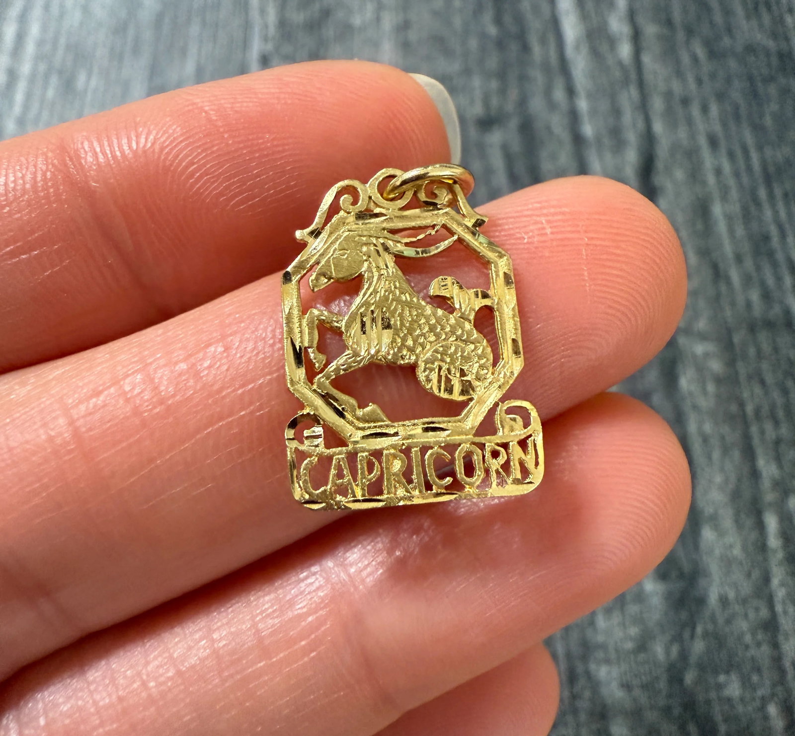 Vintage 14K Gold "CAPRICORN" Zodiac Charm: Metal: 14K Yellow Gold Weight: 1.4 gramsMeasurements: 0.8 inches long by 0.55 inches wideMarkings: "14K"Condition: In very good condition with some minor surface wear consistent with age. We'll solder