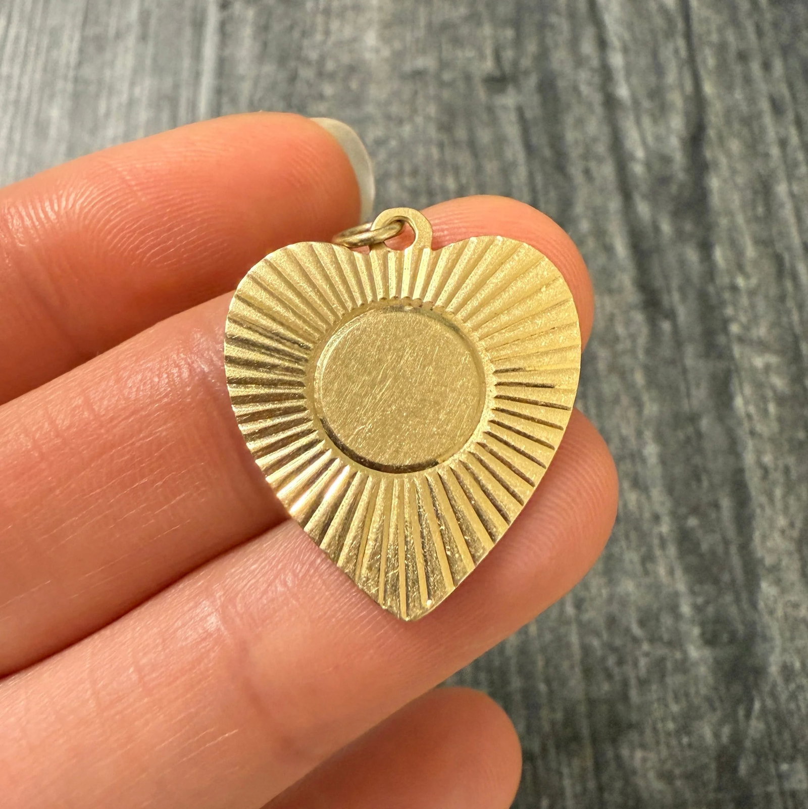 Vintage 14K Gold Engine Turned Heart Charm: Metal: 14K Yellow Gold Weight: 3.2 gramsMeasurements: 0.95 inches long by 0.9 inches wideMarkings: "14K" and inscribed "Frank & Marie Xmas '53"Condition: In good vintage condition with some surface we