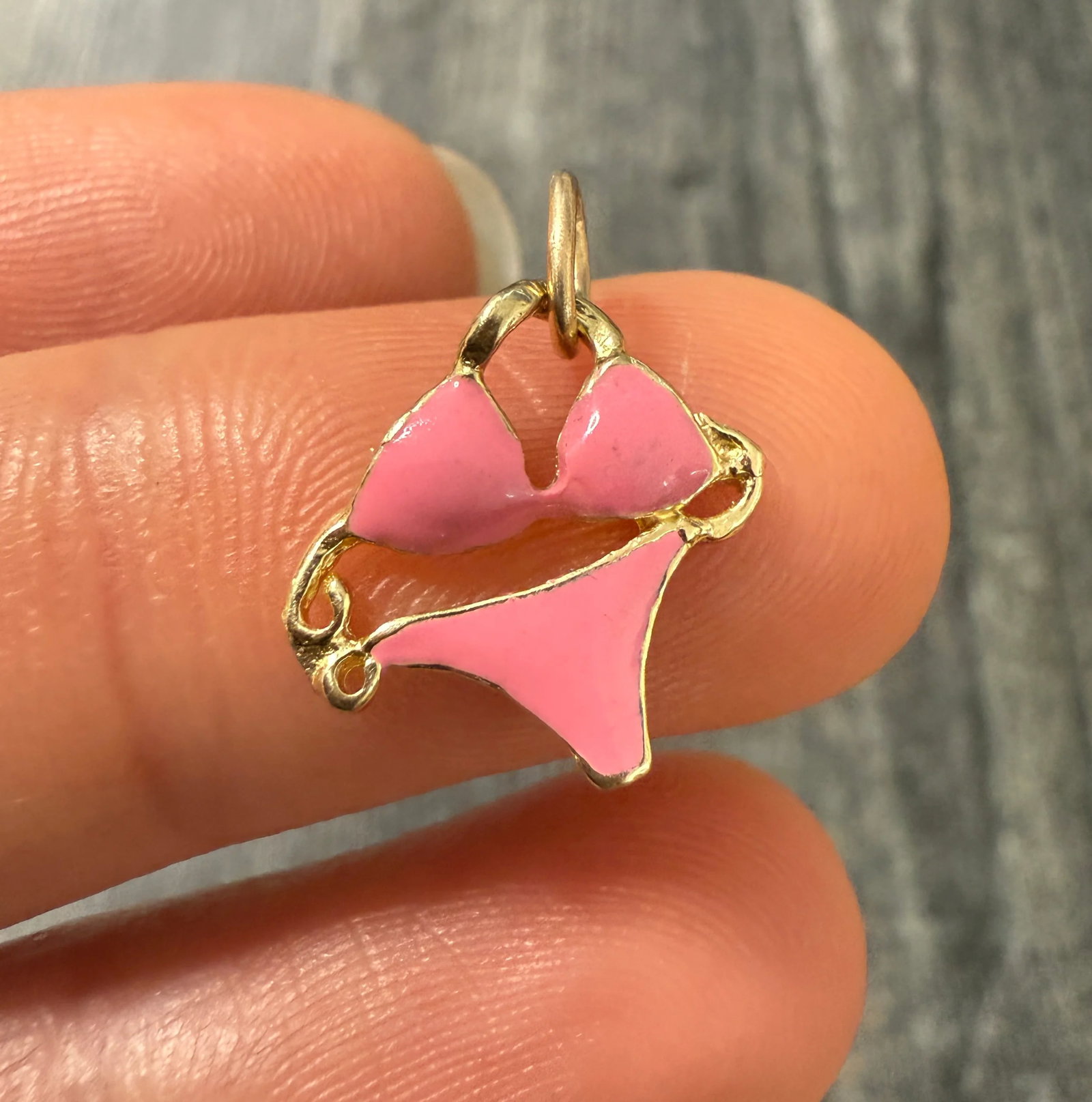 Pink Enamel and 14K Gold Bikini Charm: Metal: 14K Yellow Gold (Acid Tested)Weight: 0.85 gramsMeasurements: 0.5 inches long by 0.55 inches wideMarkings: NoneCondition: In very good condition with some minor surface wear consistent with age.