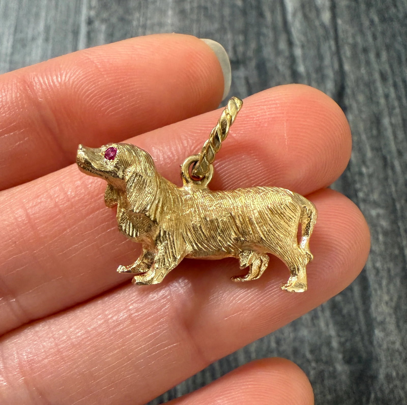 Vintage 14K Gold Spaniel Dachshund Dog Charm: Metal: 14K Yellow Gold Weight: 9.7 gramsMeasurements: 0.65 inches long by 1.1 inches wide Markings: "14K GB"Condition: In very good condition with some minor surface wear consistent with age. Follow u