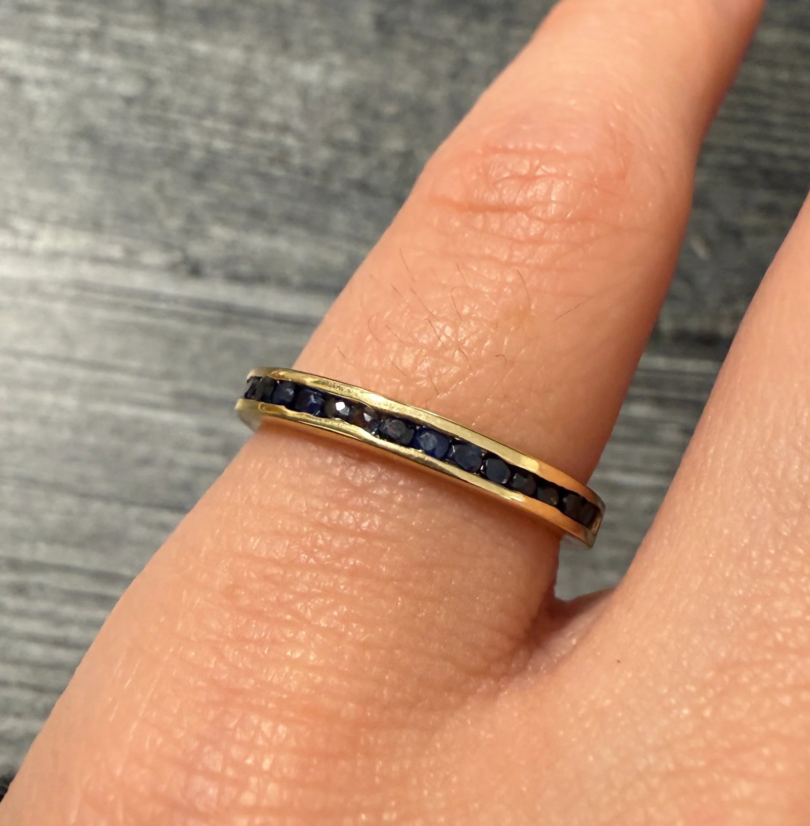 Sapphire and 14K Gold Half Hoop Band: Metal: 14K Yellow Gold Weight: 2.4 gramsSapphires: Approximately 0.38 caratsRing Size: 5.25 (resizable)Width: 2.5 mm wideMarkings: "14K"Condition: In very good condition with some minor surface wear c