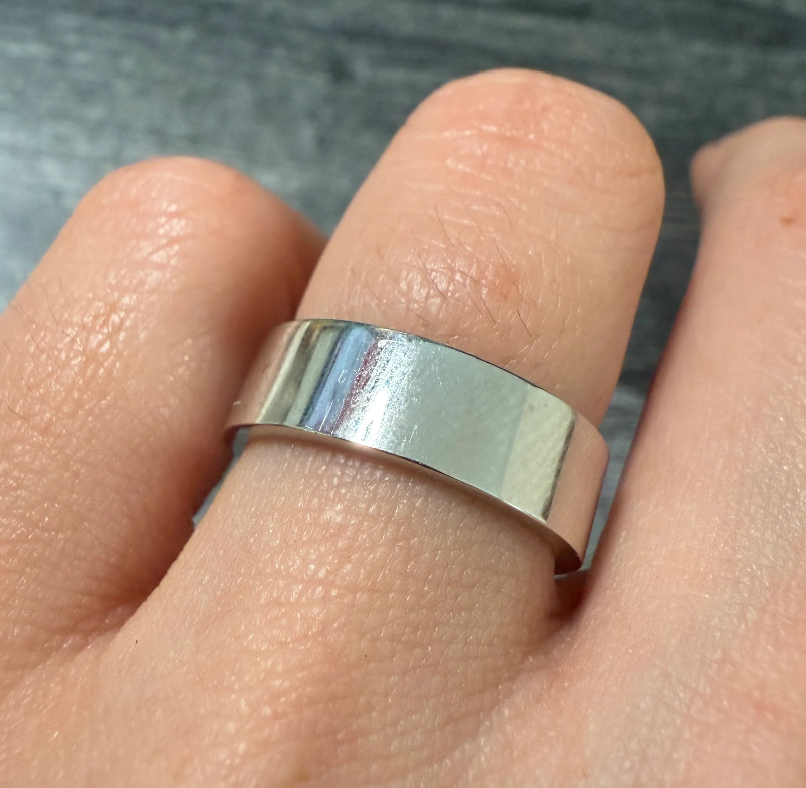 Diamond and 14K White Gold Flat Band, Size 7: Metal: 14K White Gold Weight: 7.3 gramsDiamonds: Approximately 0.02 caratsRing Size: 7 Width: 6 mm wideMarkings: "14K RC"Condition: In very good condition with some minor surface wear consistent with 