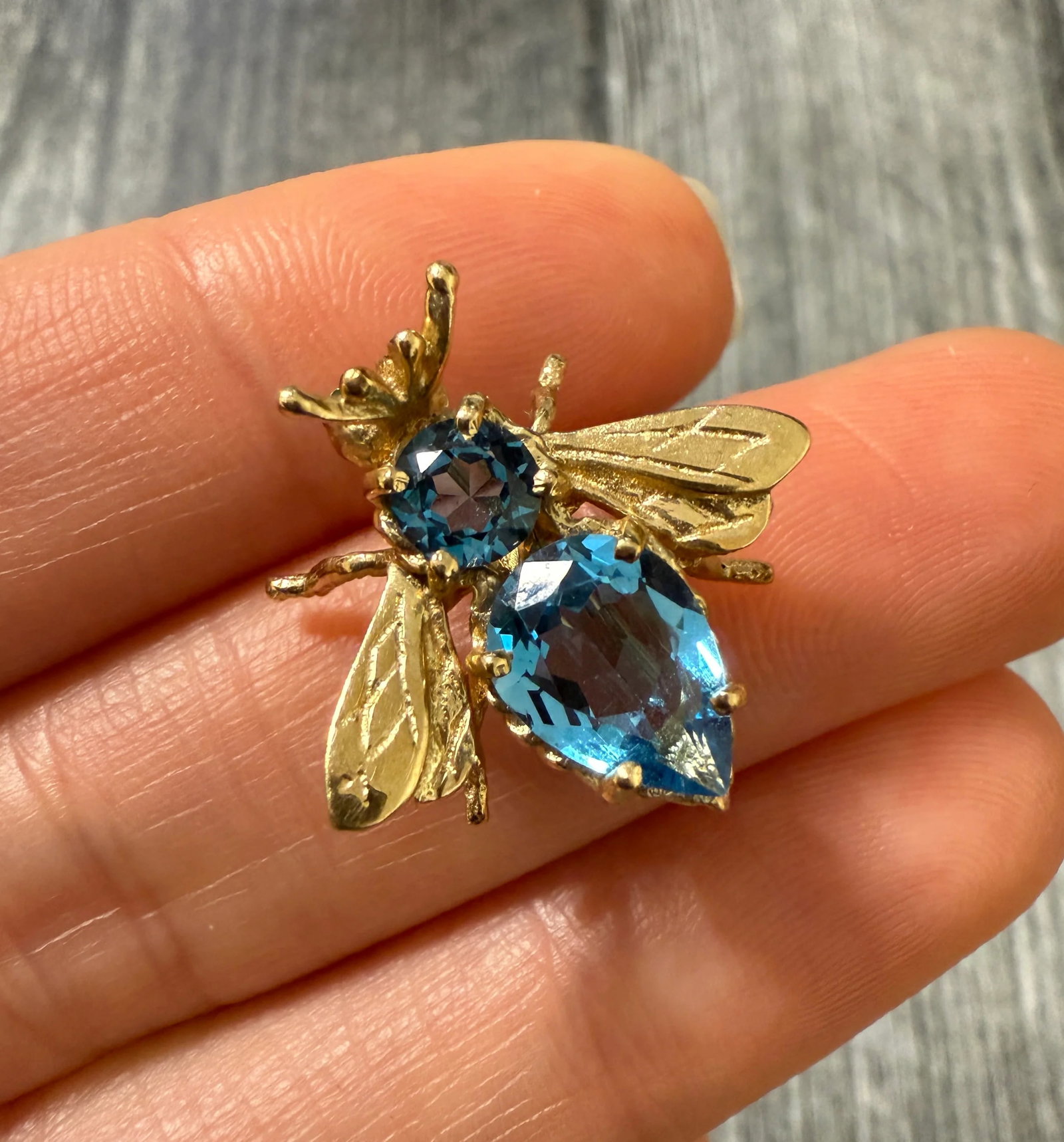 Blue Topaz and 14K Gold Bee Pin: Metal: 14K Yellow Gold Weight: 3.3 gramsMeasurements: 0.75 inches long by 0.8 inches wideMarkings: NoneCondition: In very good condition with some minor surface wear consistent with age. Follow us on 