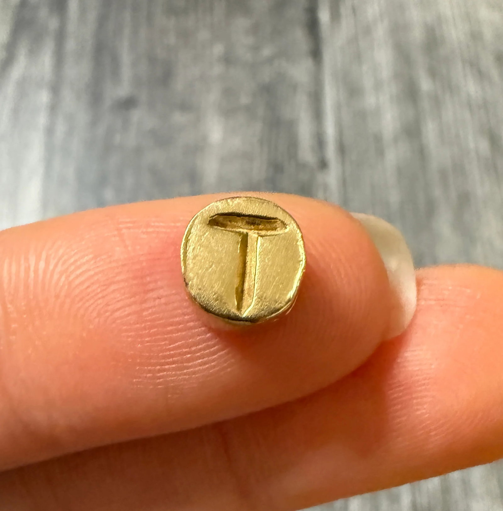 Vintage 14K Gold Initial "T" Circular Charm: Metal: 14K Yellow GoldWeight: 1.3 gramsMeasurements: 0.25" wideMarkings: "14K"