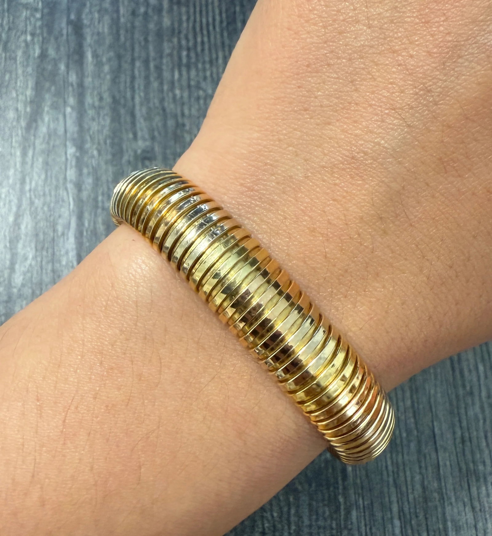 Vintage 18K Tricolor Gold Tubogas Bracelet, 7.65" Long: Metal: 18K Yellow, Rose and White Gold Weight: 27.8 gramsMeasurements: 7.65 inches long (some stretch) by 20 mm wideMarkings: "750"Condition: In very good condition with some minor surface wear consis