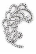 Platinum 9.00 Ct. Diamond Brooch: Mid-century inspired openwork cluster brooch structured in heavy platinum with 9.00 carats of fine white diamonds.