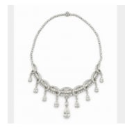 1950’s Platinum & Pear Shape Diamond Necklace: Mid-century high-jewelry statement necklace crafted in heavy platinum and set with brilliant pear-shaped diamonds.